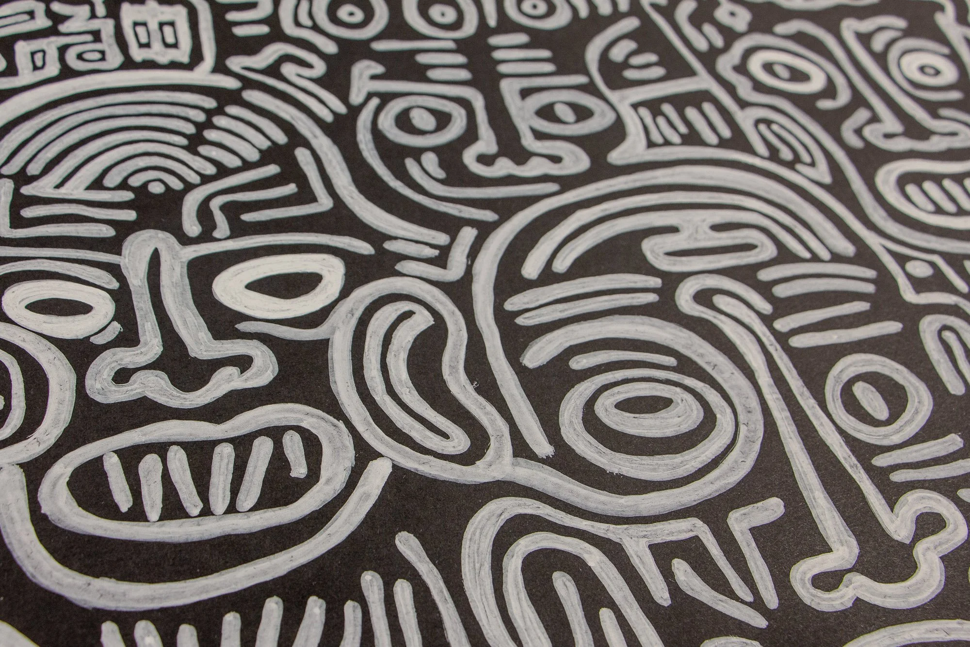 Mêlée of Discovery 001 detail: angled close-up of the composition, where a central face and surrounding figures emerge in white linework against the dark ground, emphasizing the series’ shifting field of oppositions.