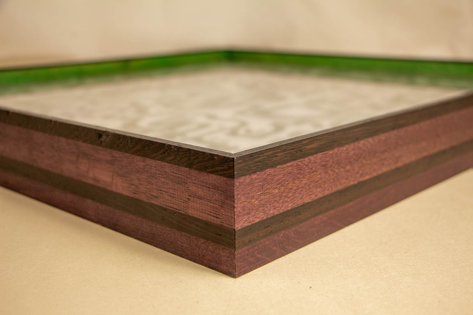 Formless Equation 001 frame: purpleheart frame with wengé cap and band, tight mitred corner, glass set flush, lime-green inner spacer