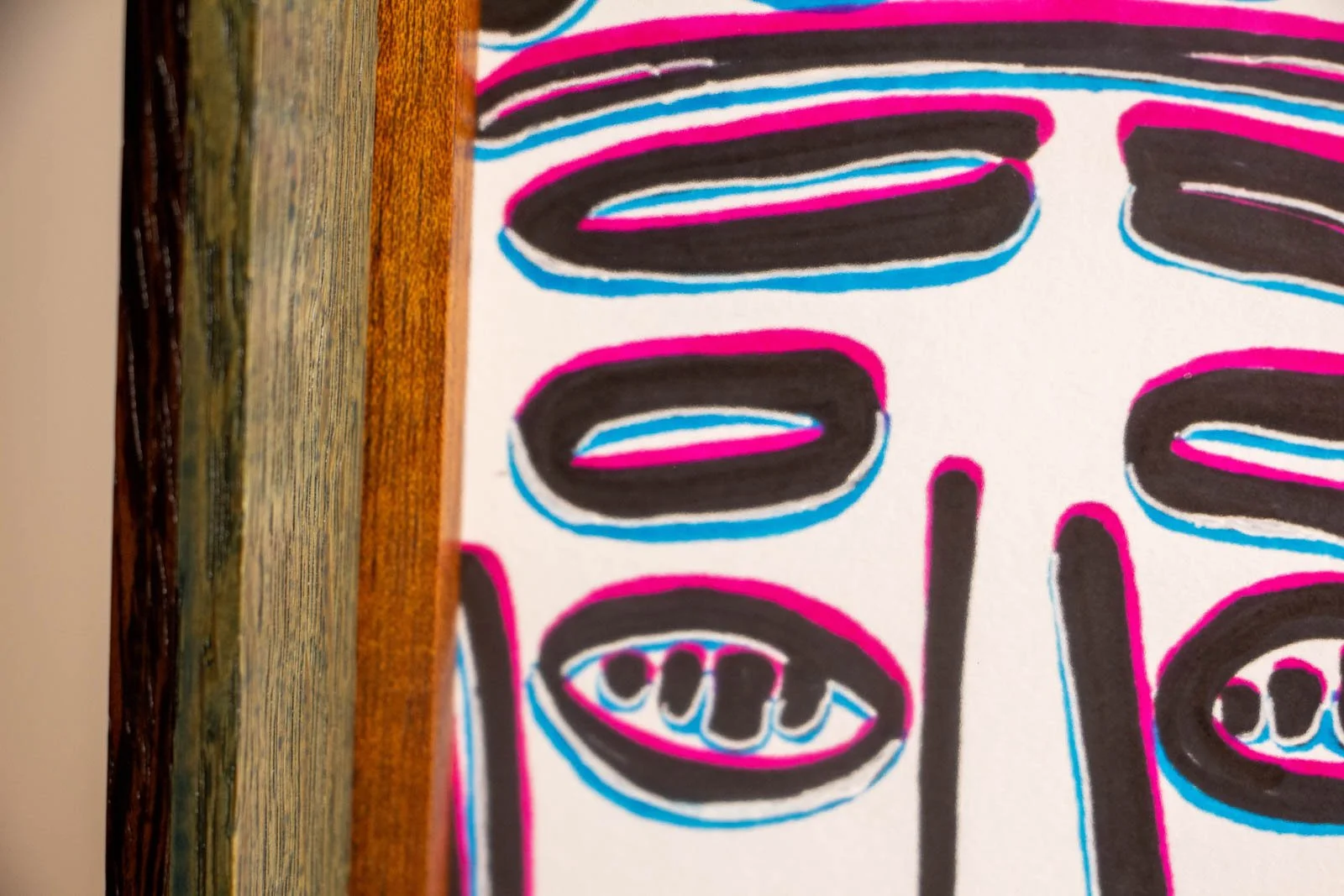 Silence’s Caesura 002 frame: right inner margin, mahogany slip framing the paper; shallow float gap; cyan and pink after-image adds depth