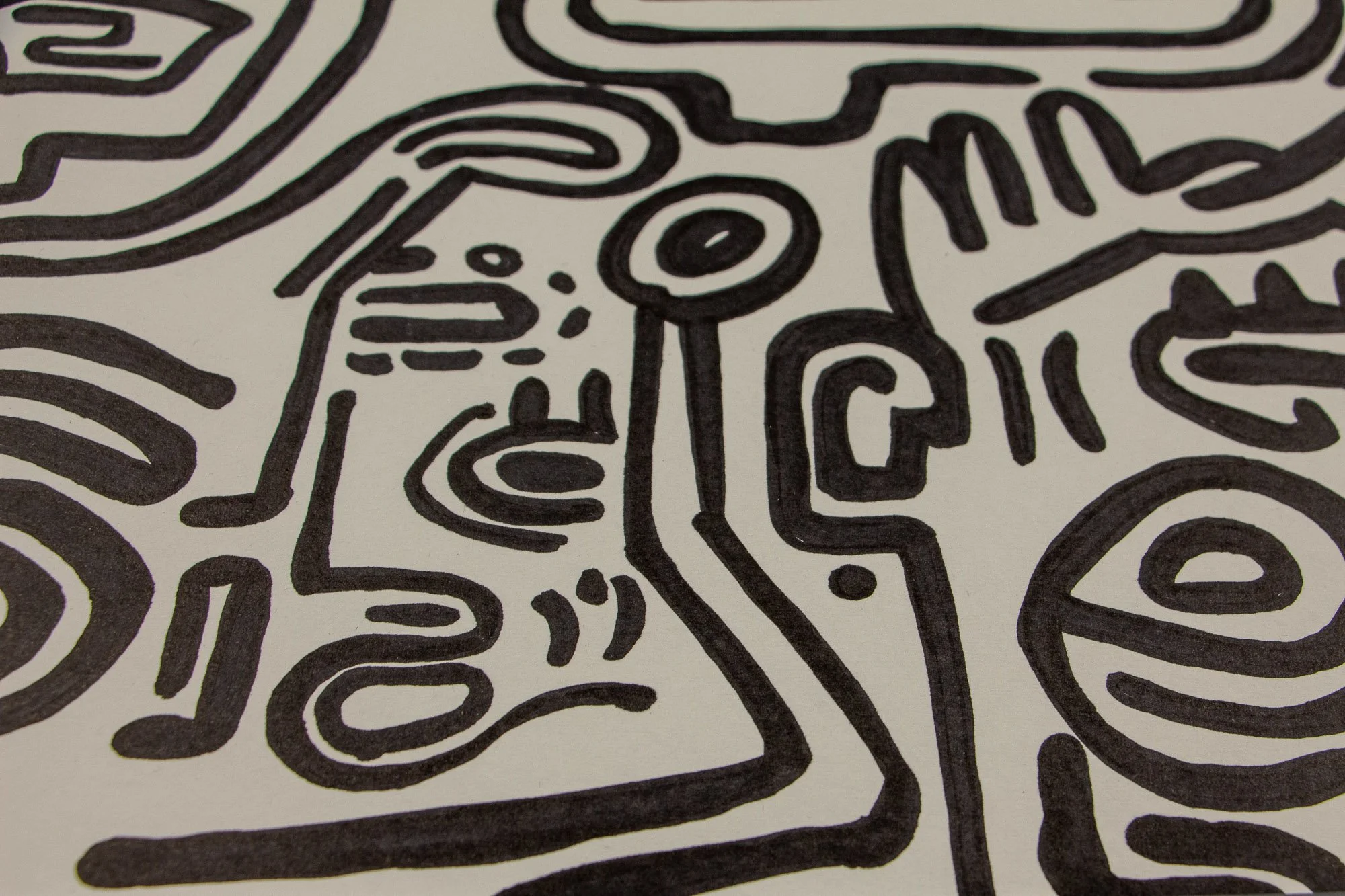 Resonant Syntax 002 detail: close-up of a small central face with dotted markings, almond eye, and circular symbol above; surrounded by dense black linework and adjacent facial fragments