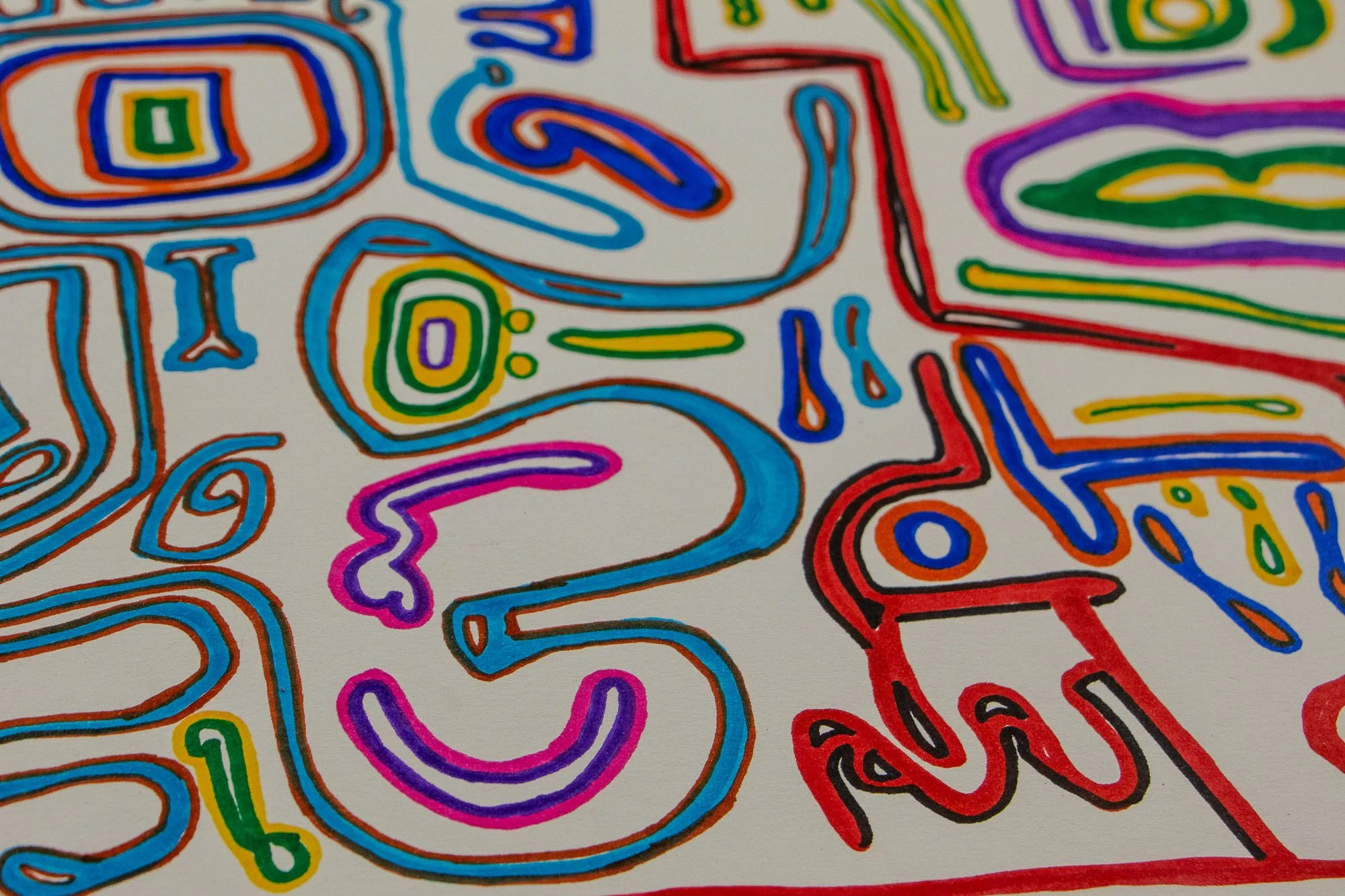 Eclipsing Gravitas 002 detail: close-up of flowing abstract forms with blue, pink, purple, red, yellow, and green contours, combining oval motifs, curved lines, and face-like fragments across the paper.