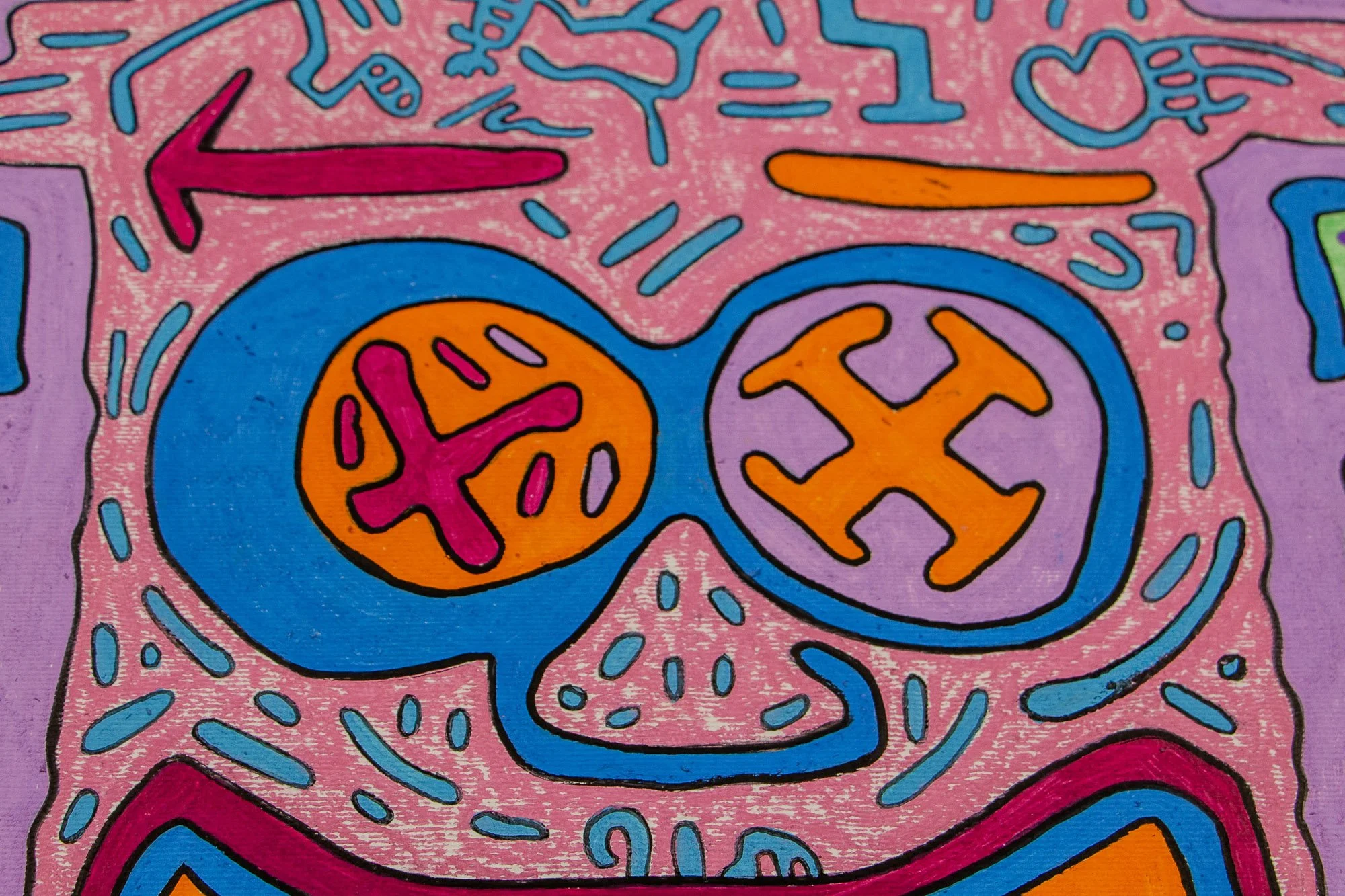 Unseen Signifiers 005 detail: close-up of the upper face, focusing on the blue eye forms, orange and lilac inner symbols, and the blue nose set within the pink field.