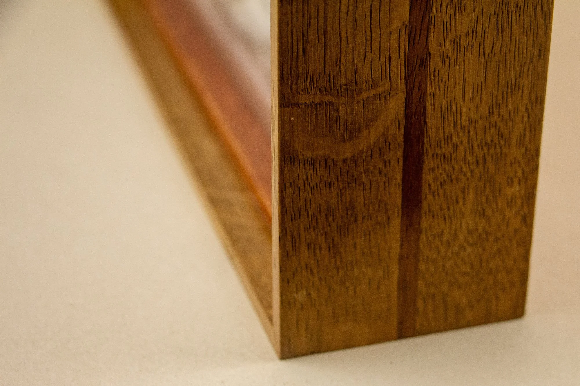 Veiled Alchemist 004 frame detail: vertical close-up of the side edge, focusing on the Japanese elm grain, the narrow inner band, and the depth of the boxed frame construction.