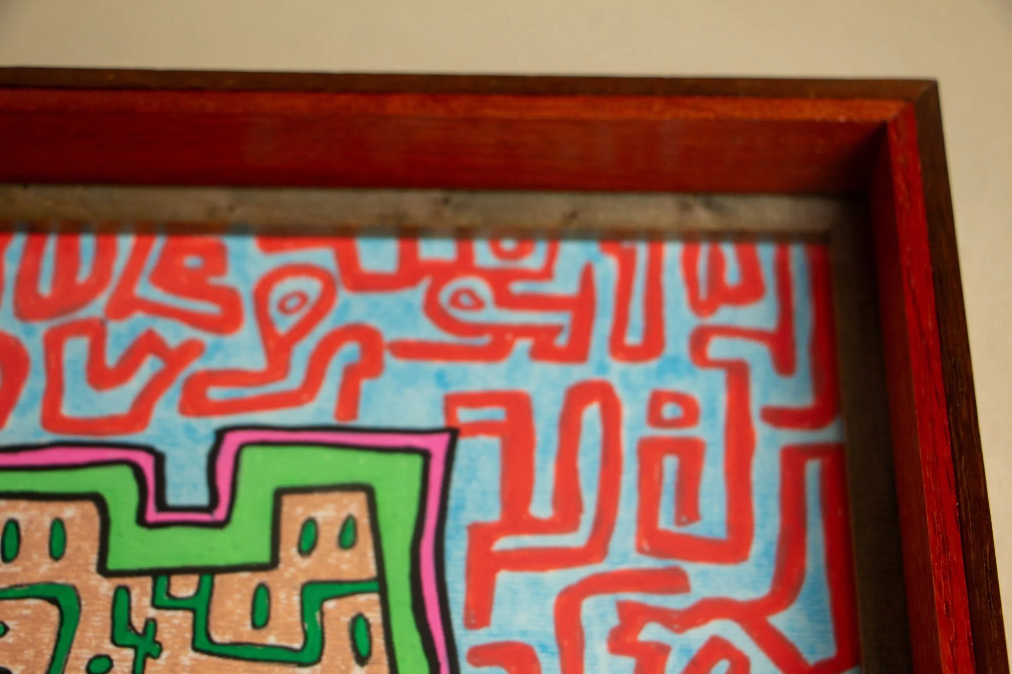 Unseen Signifiers 008 frame detail: top-down close-up of the upper-right frame corner, showing the red inner edge, dark inner border, and clean mitered construction. mahogany, oak and beech wood.