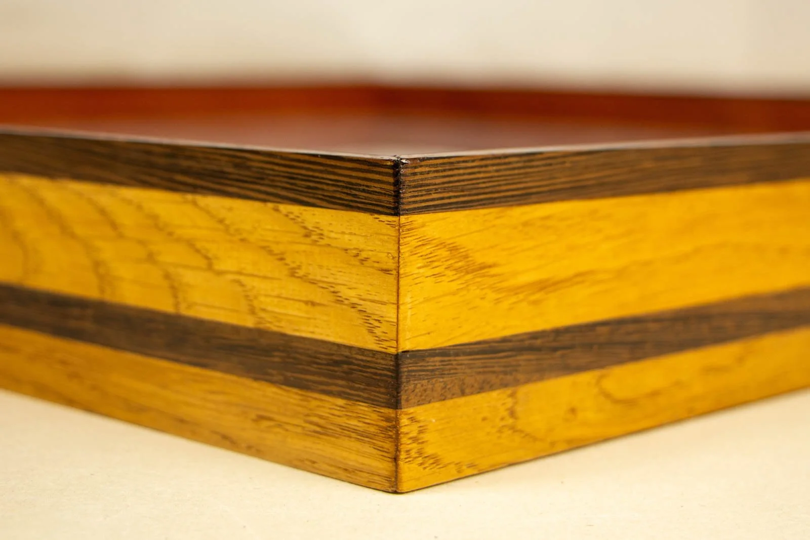 Metamorphic Entwining 002 frame: outside mitre; wengé cap and central band align neatly across the joint; tight, clean corner