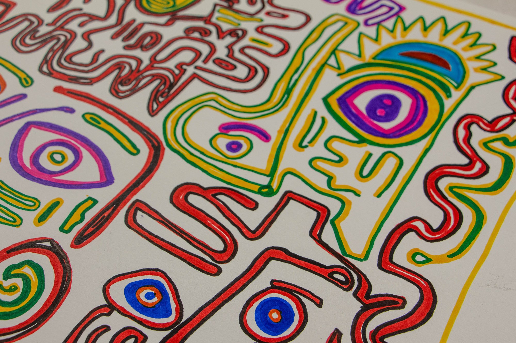 Eclipsing Gravitas 002 detail: close-up of a multicolored face-like form in yellow, green, purple, and blue, with one large eye, crown-like spikes above the head, and surrounding red and pink linear motifs.