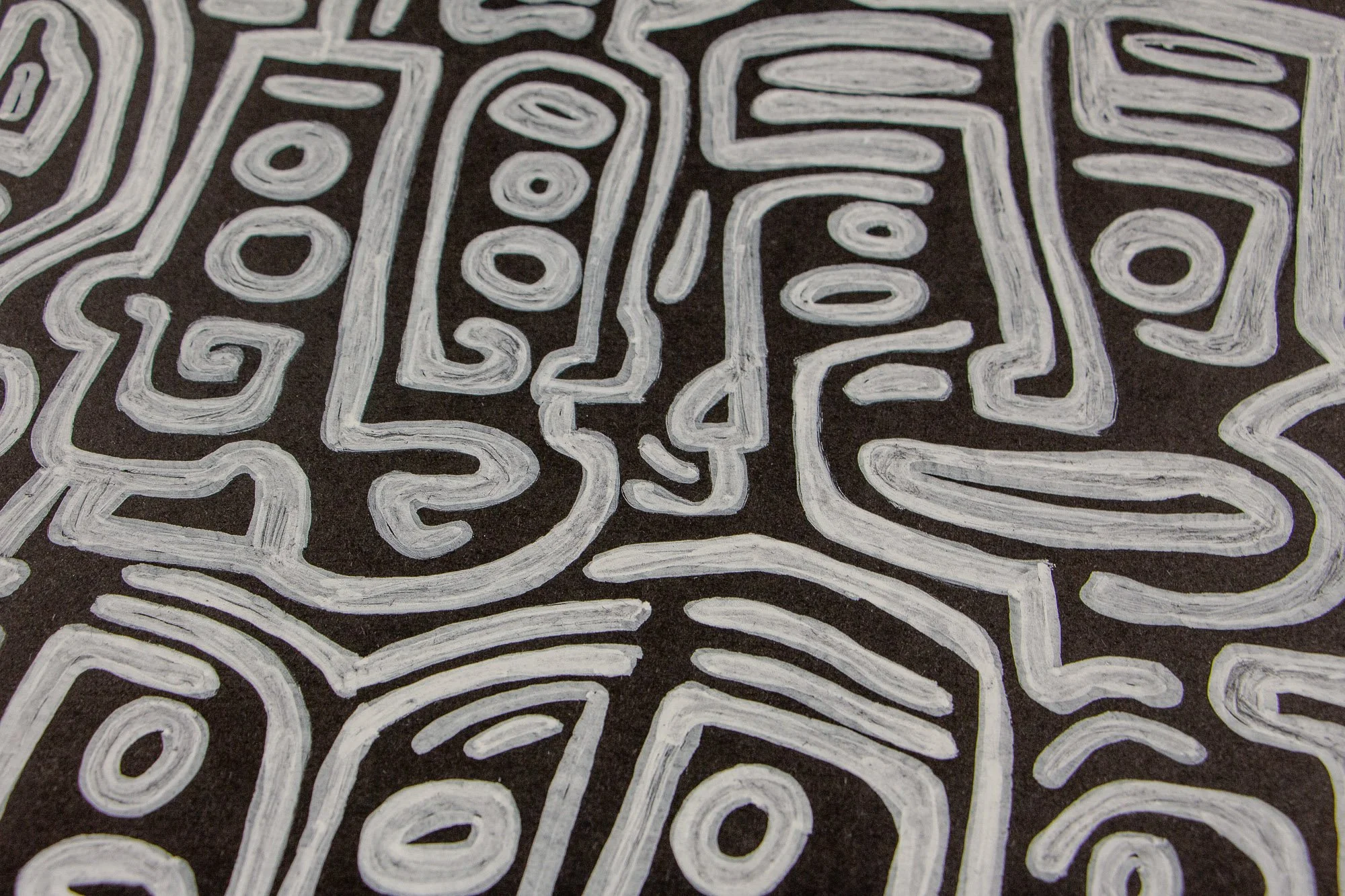 Mêlée of Discovery 005: detail of stacked vertical face-like motifs and looping symbols, emphasizing the rhythmic repetition of white marks on black.
