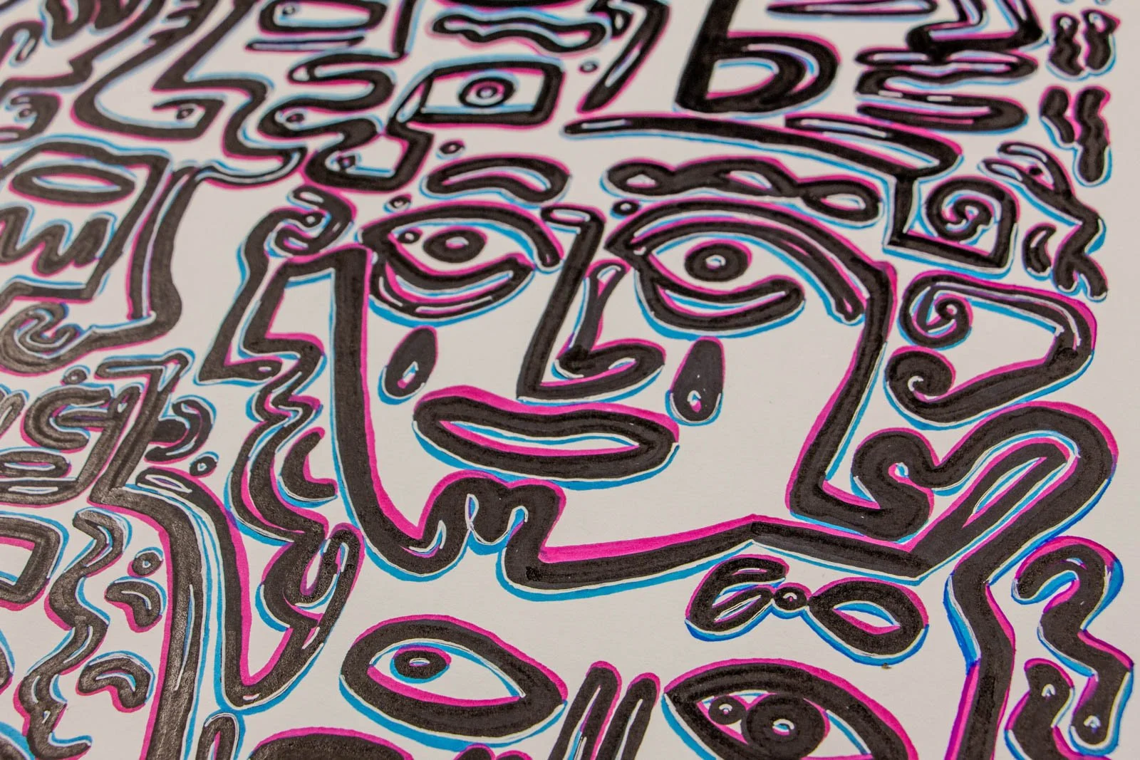 Silence’s Caesura 003 detail: large frontal face with double teardrop motifs; bold contours, soft cyan/pink offset along the edges