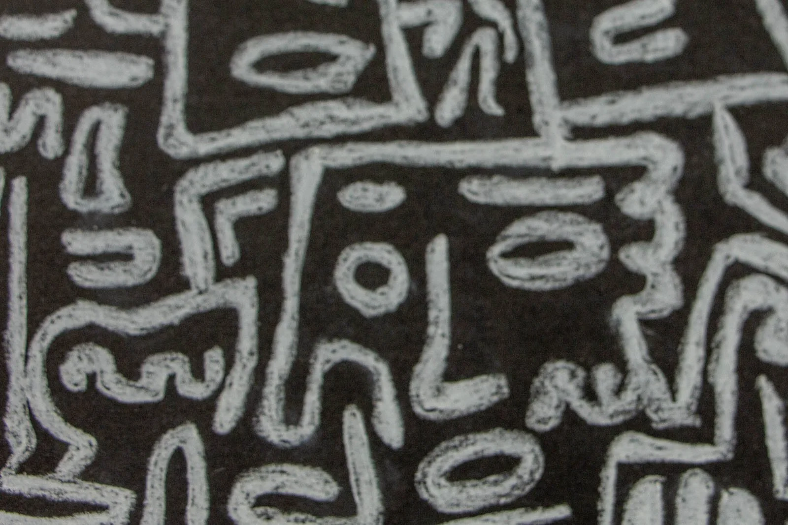 Synaptic Mythos 003 detail: compact glyph cluster, ovals, dots, hooks and a tiny mask-face boxed in; chalky, layered lines with soft grey halos