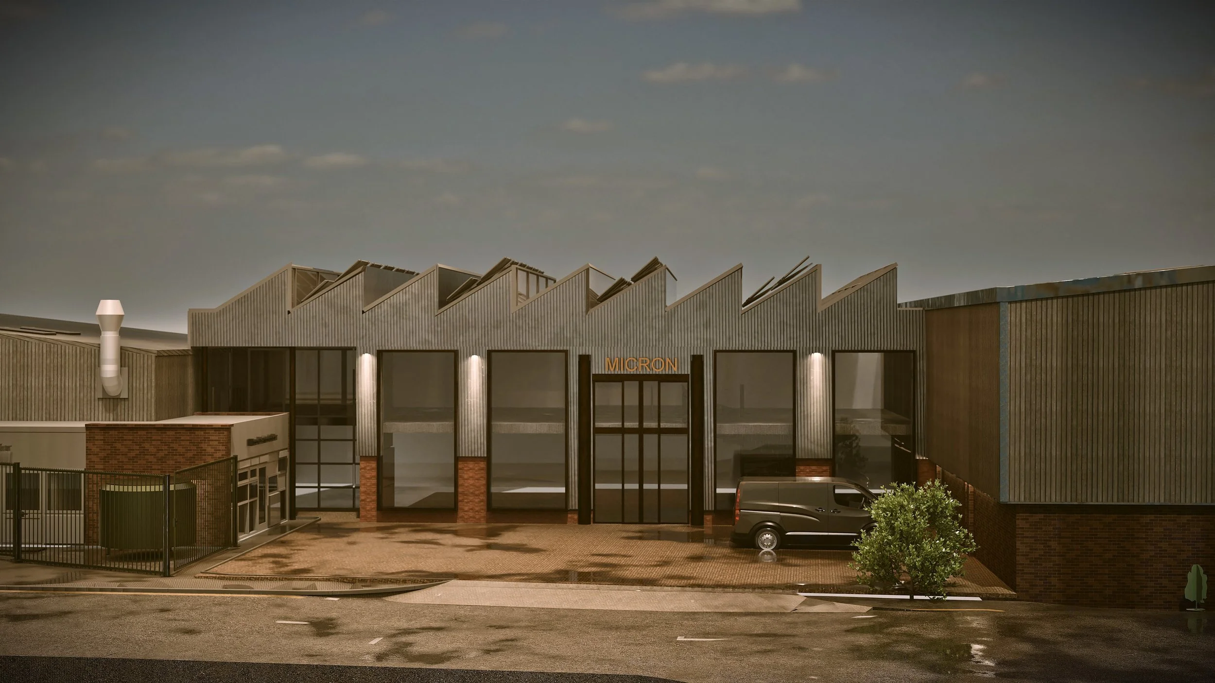 Front Elevation — The rhythm of glazed panels between dark mullions and brick piers, north-light roofline above.
