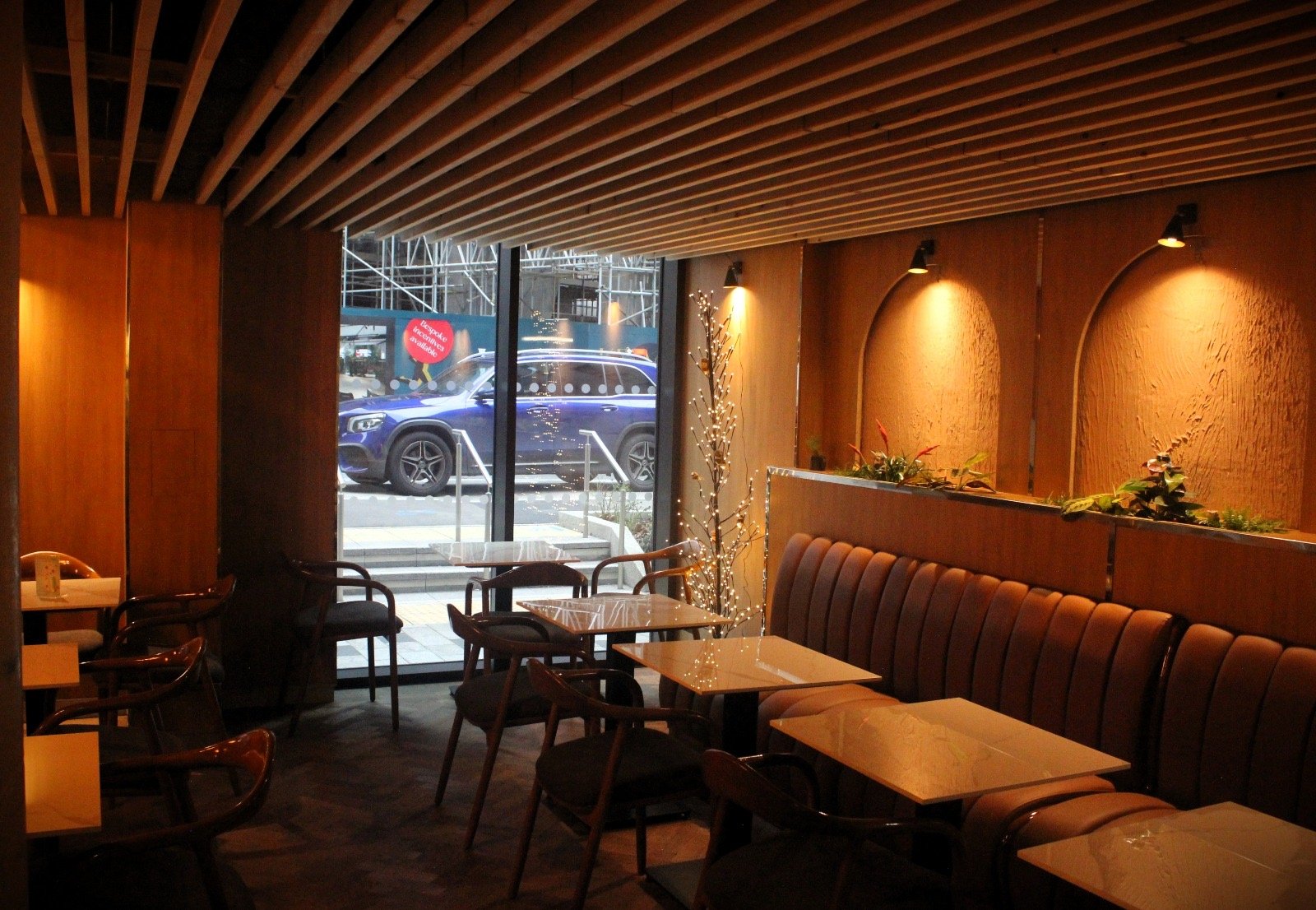 Completed Interior — Seating area with street frontage.