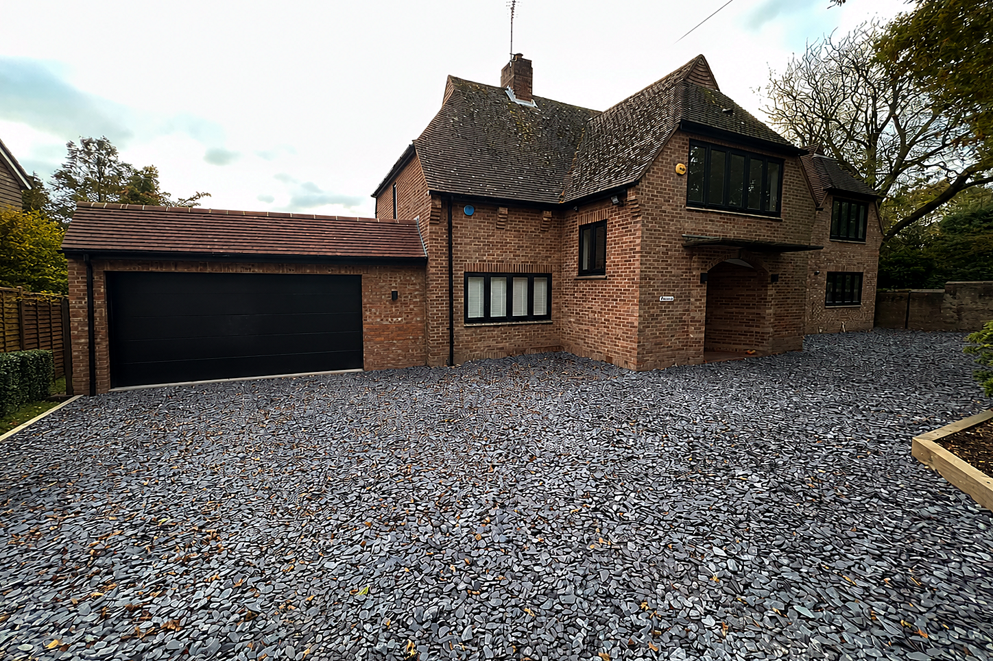 Front Approach — Existing house and driveway.