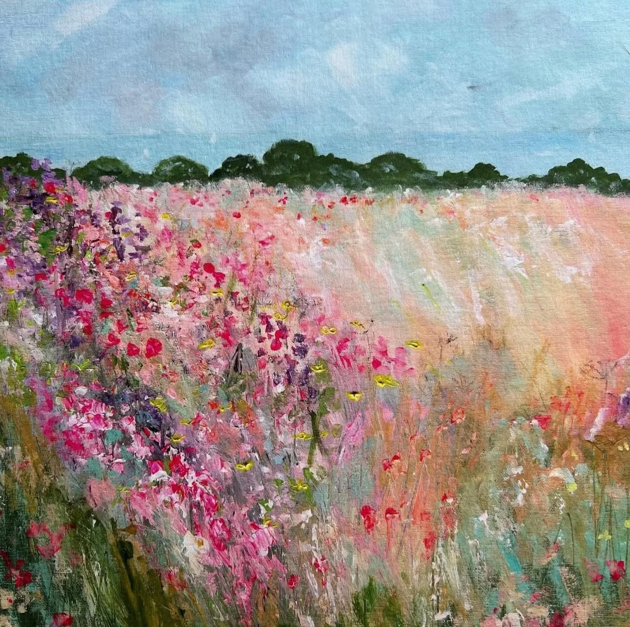 Painting of a colorful wildflower field under a blue sky with trees in the distance.