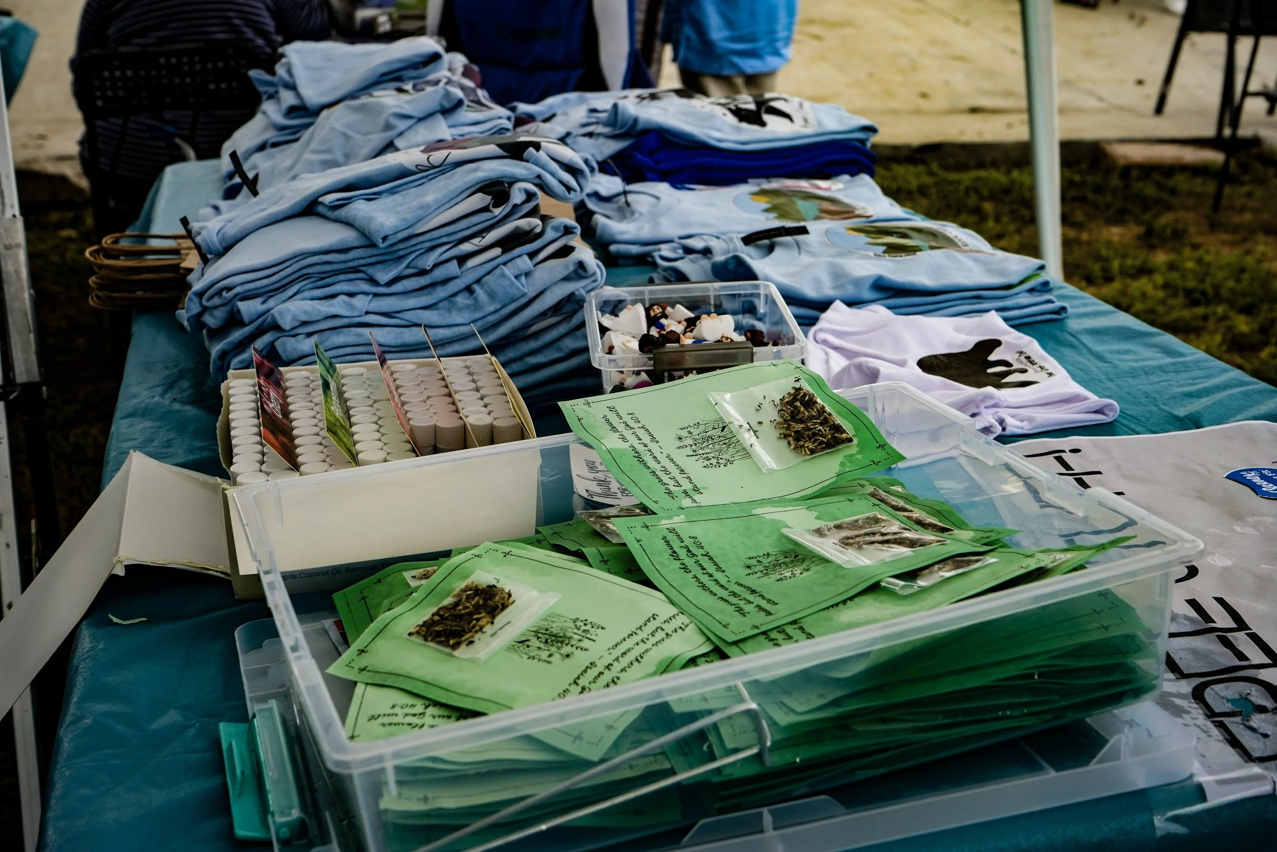 free t-shirts and other giveaway items from the "Free Stuff" table at groundbreaking celebration