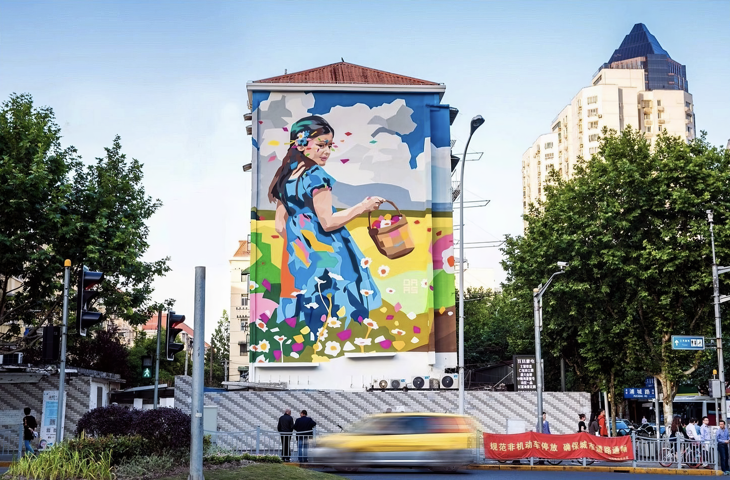 Work by the artist DAAS, Large colorful mural of a girl in a blue dress holding a basket of flowers on the side of a building surrounded by trees, buildings, traffic lights, and people.