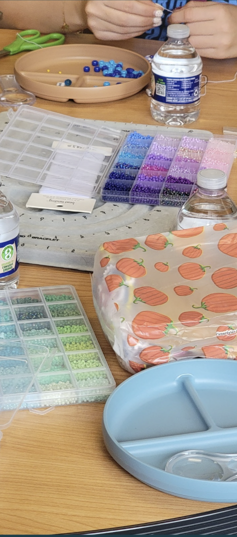 Assortment of beads and string on a table