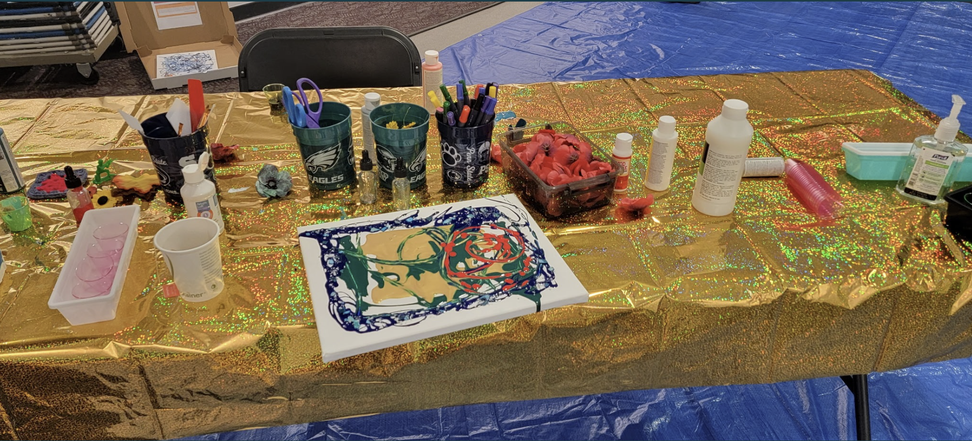 A table with a painted canvas.