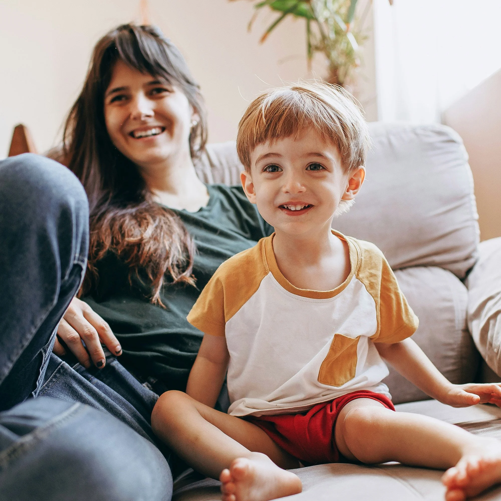 A mother and child in a clean, mold-free home after BAM Restoration services.