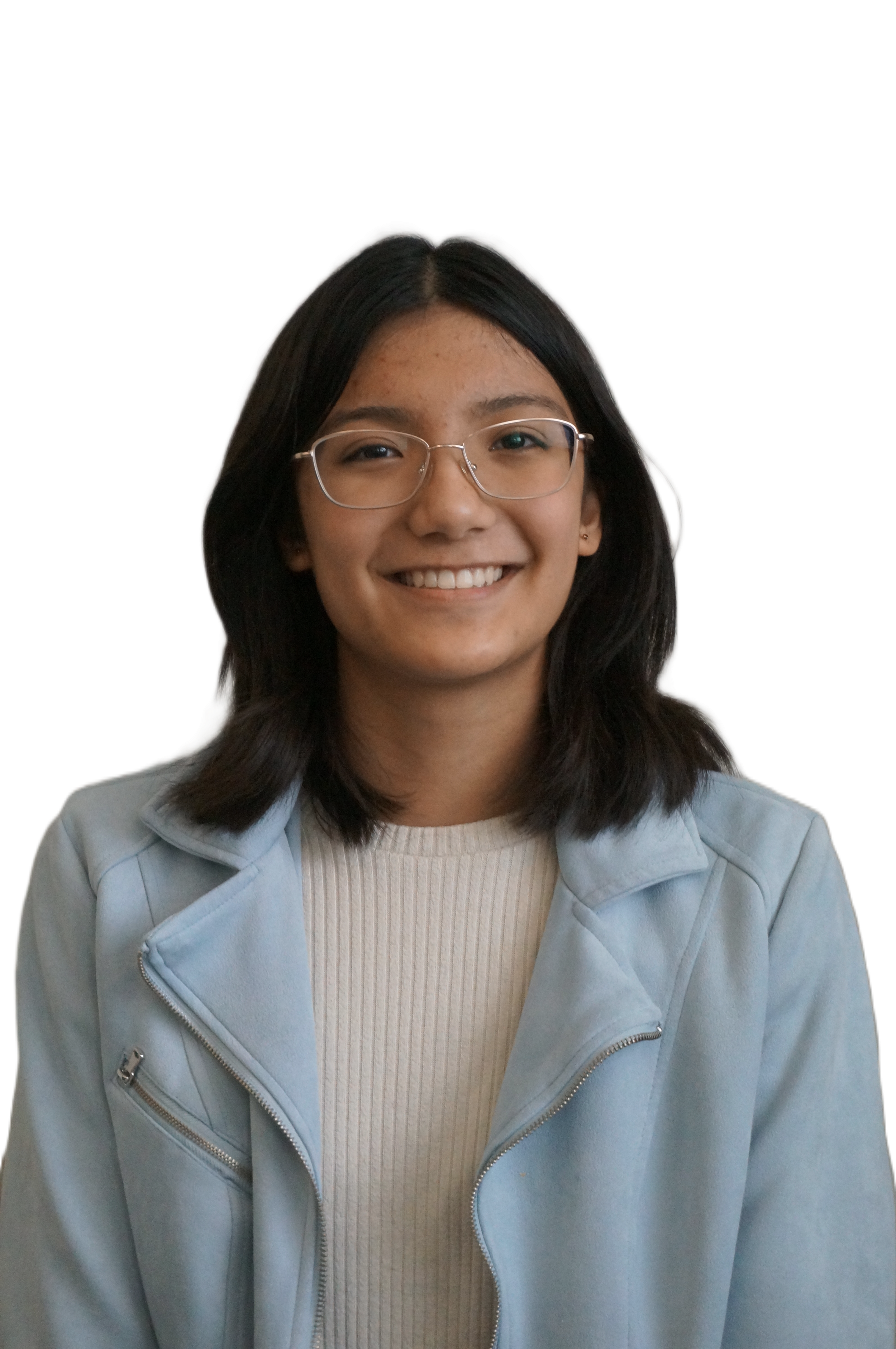 A smiling young woman with glasses, shoulder-length dark hair, wearing a light blue jacket and white ribbed sweater.
