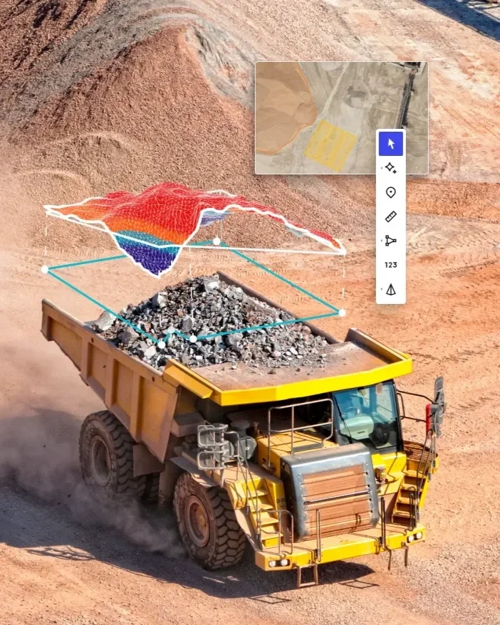 A large yellow dump truck carrying rocks and gravel, with a colourful, 3D volumetric map overlay and associated volumes by DeepSky IQ drones