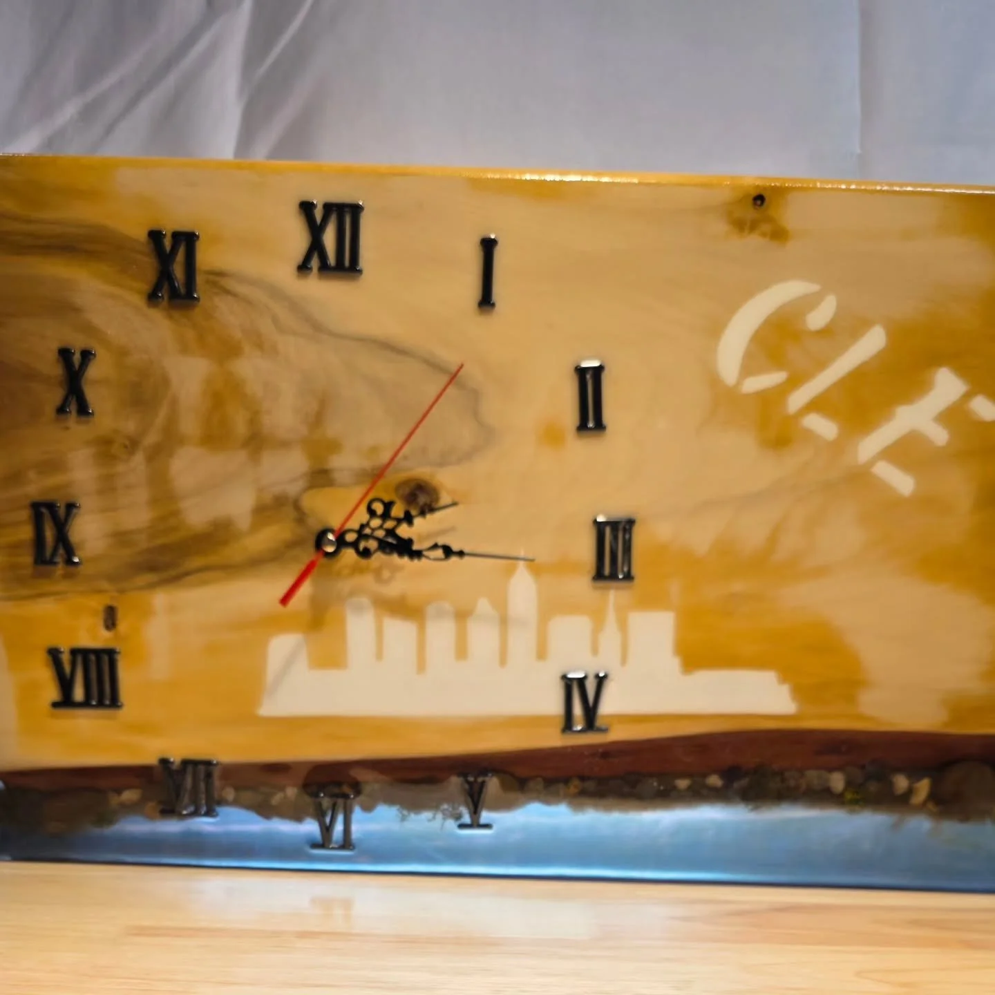 Handcrafted Cleveland-Themed Resin Wall Clock &ndash; SOLD - ORDER YOURS CUSTOM 

Show your Cleveland pride with this one-of-a-kind handcrafted wall clock, featuring a striking silhouette of the city skyline and bold &ldquo;CLE&rdquo; lettering embed