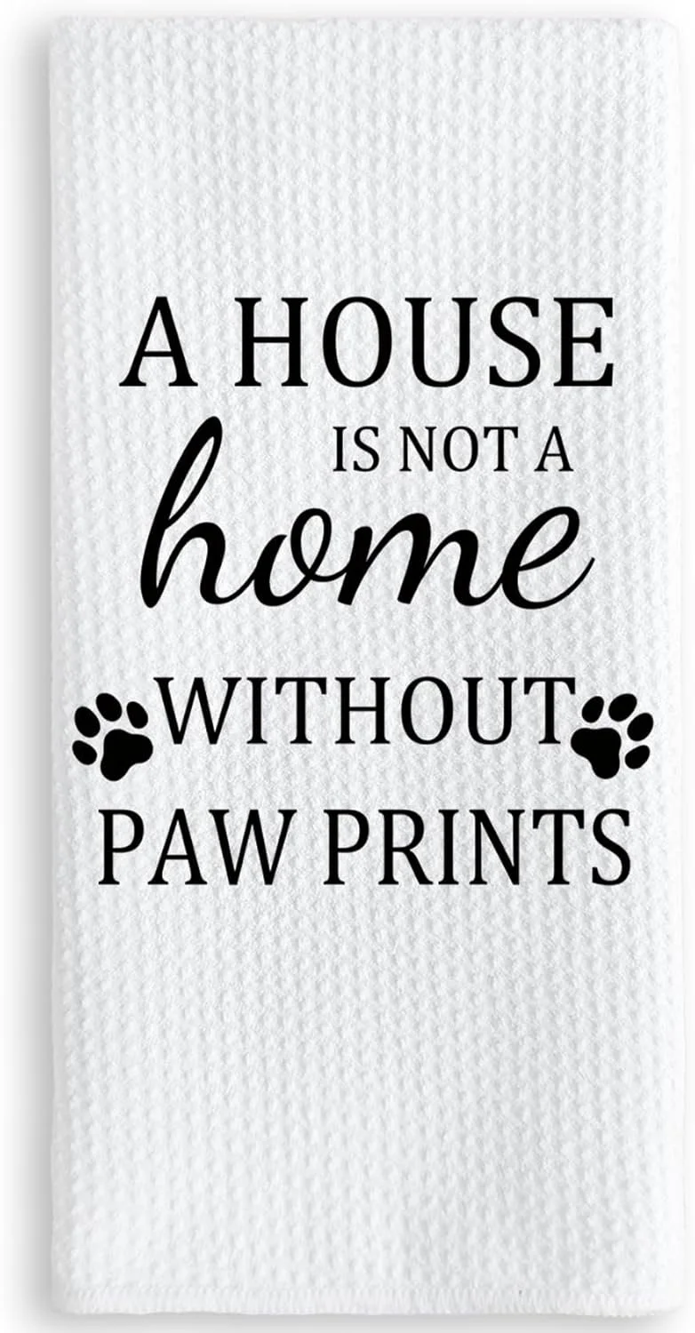 A white towel with black text that reads, "A house is not a home without paw prints," and features paw print graphics.