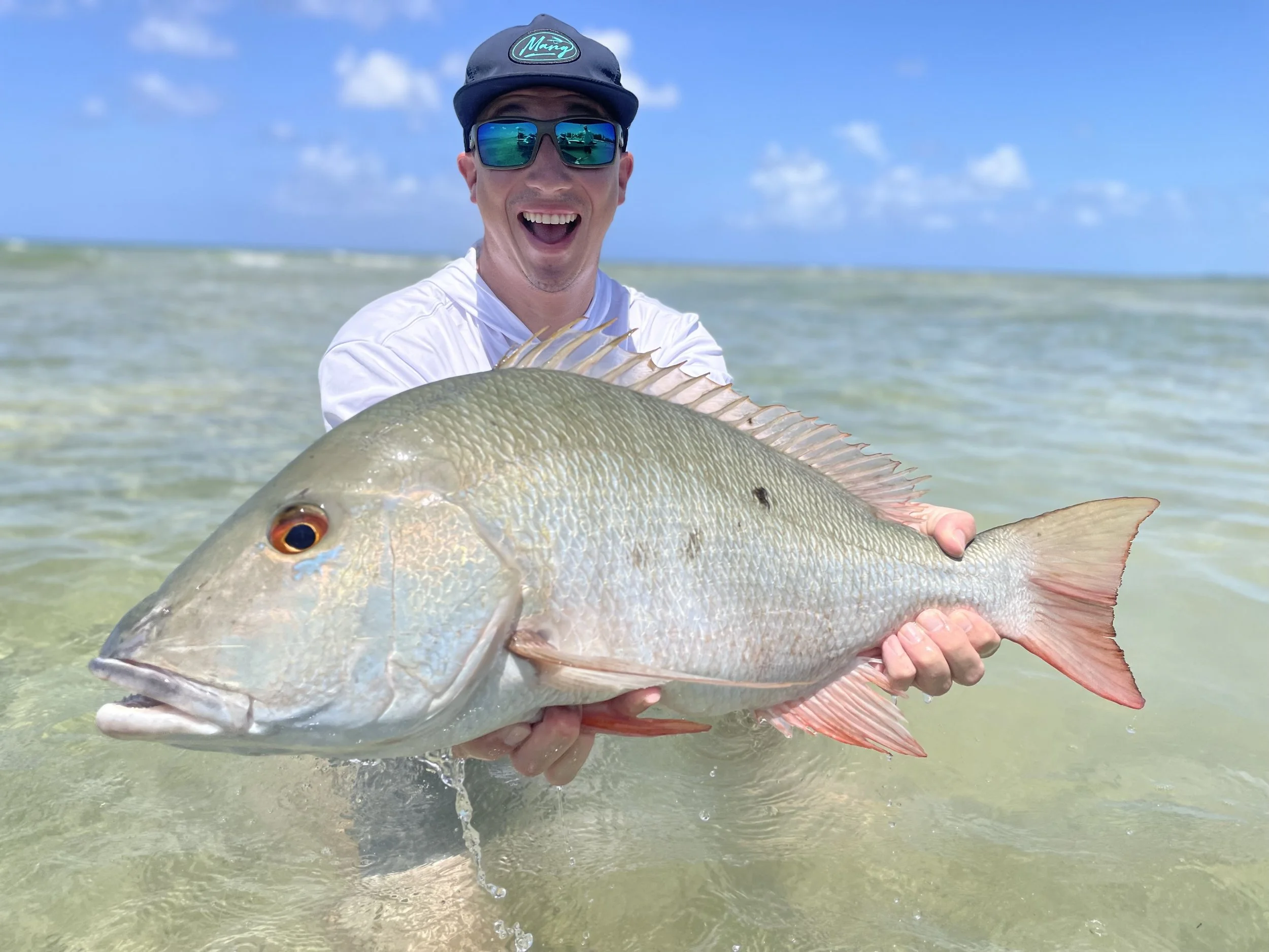 Record mutton snapper caught in the shallow waters of Grand Bahama, Bahamas.