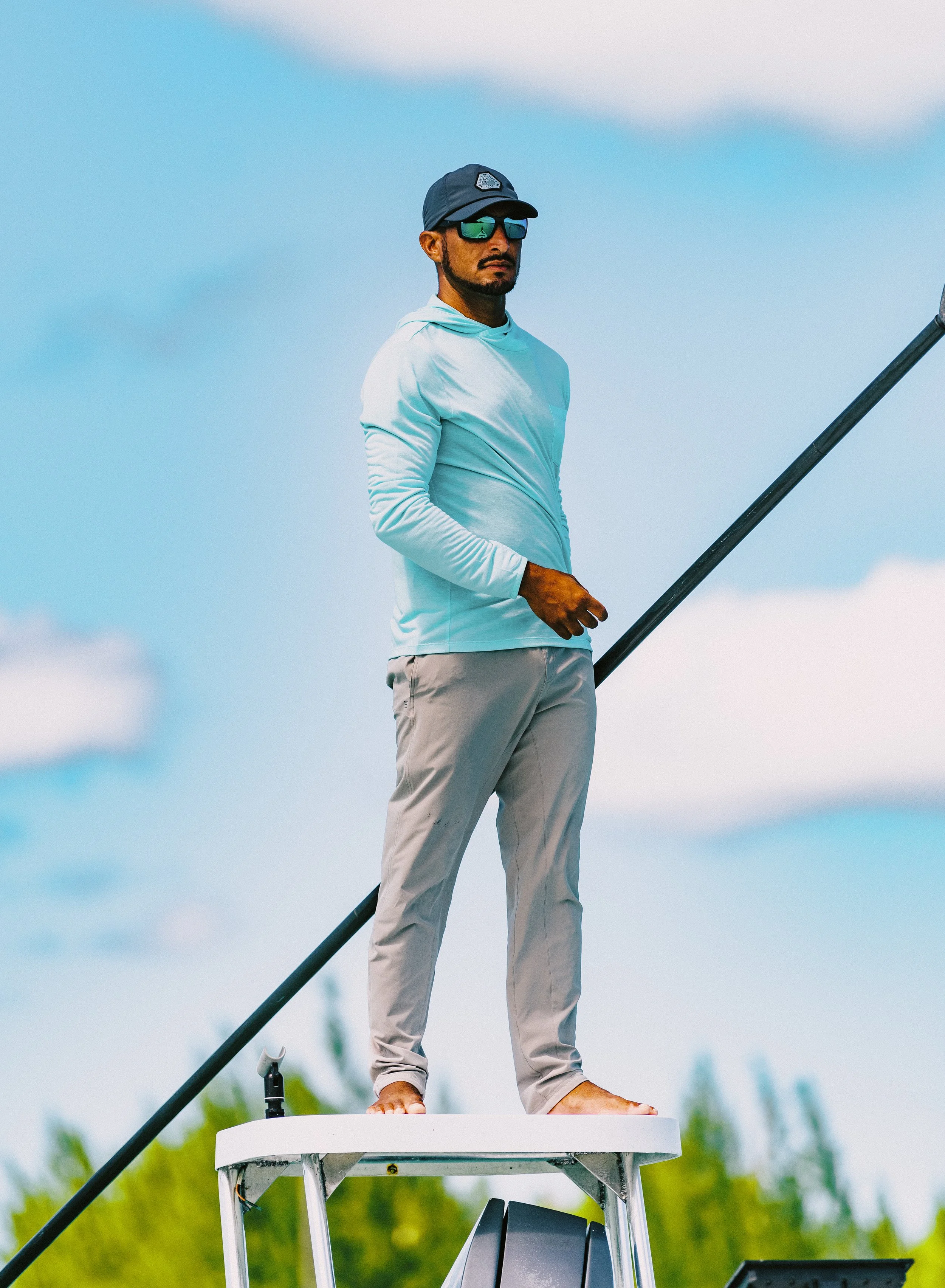 Captain Justin Lewis poling a skiff on the flats of Grand Bahama, Bahamas.