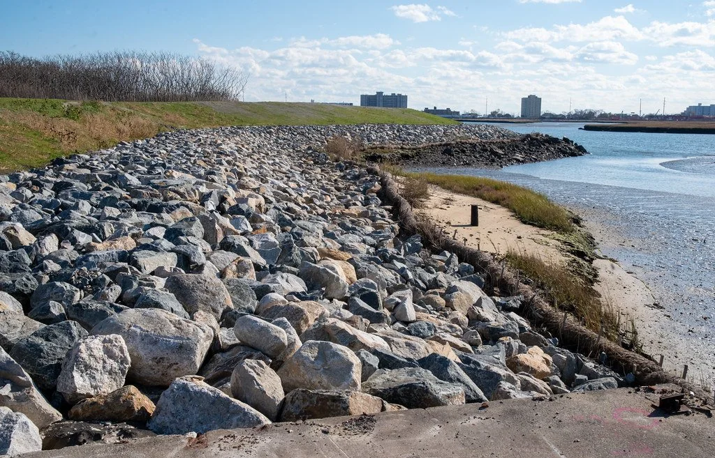 What happens when tens of thousands of gallons of water are poured on top of a landfill?