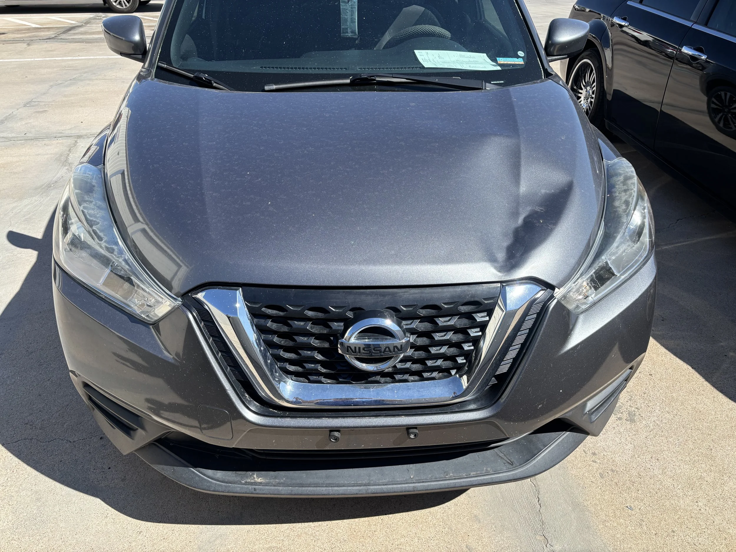 2019 Nissan Kicks - We repaired the front headlight and replaced the hood on this Nissan, making it like-new again.