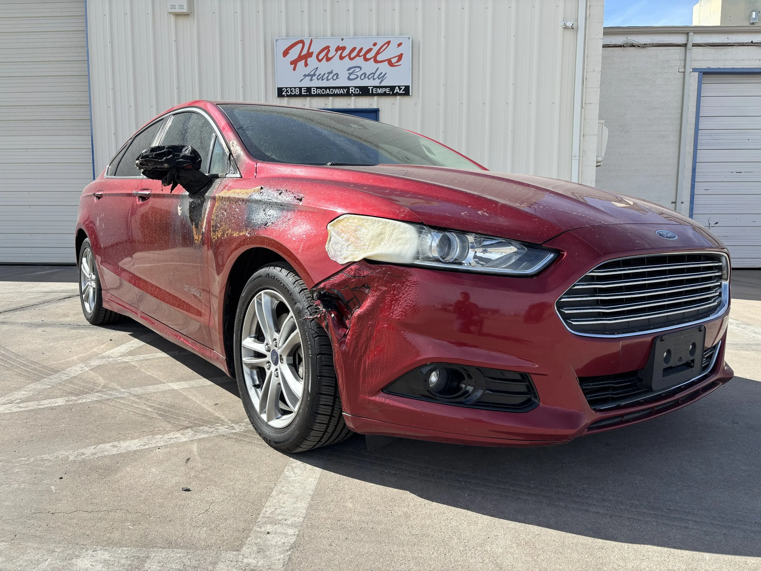 2016 Ford Fusion - We repaired heat and collision damage on the front fender, bumper, and side mirror of this Ford Fusion, restoring its factory finish.