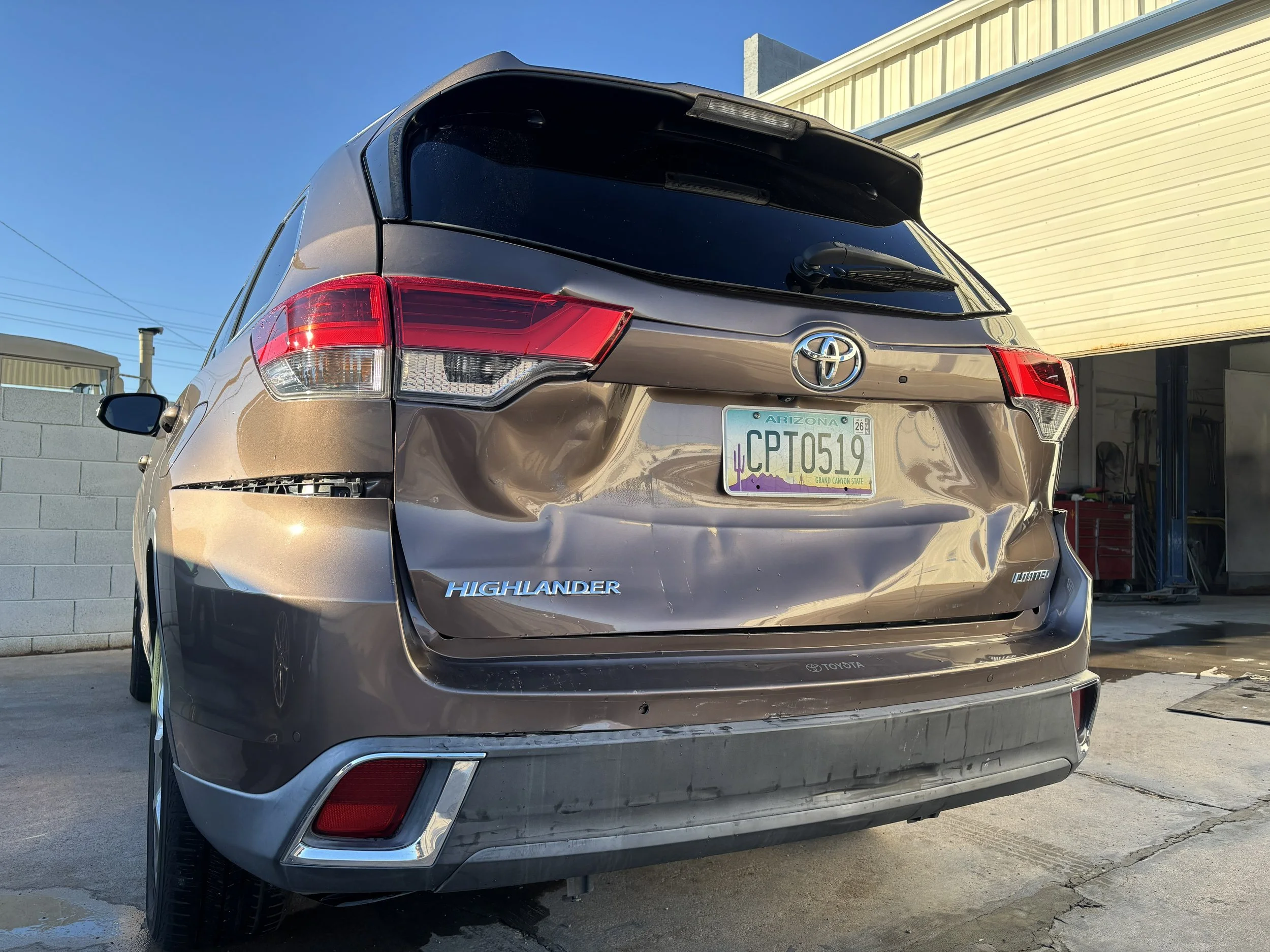 2019 Toyota Highlander Limited - We repaired rear-end collision damage on this Toyota Highlander, replacing the liftgate and rear bumper and bringing it back to flawless condition.