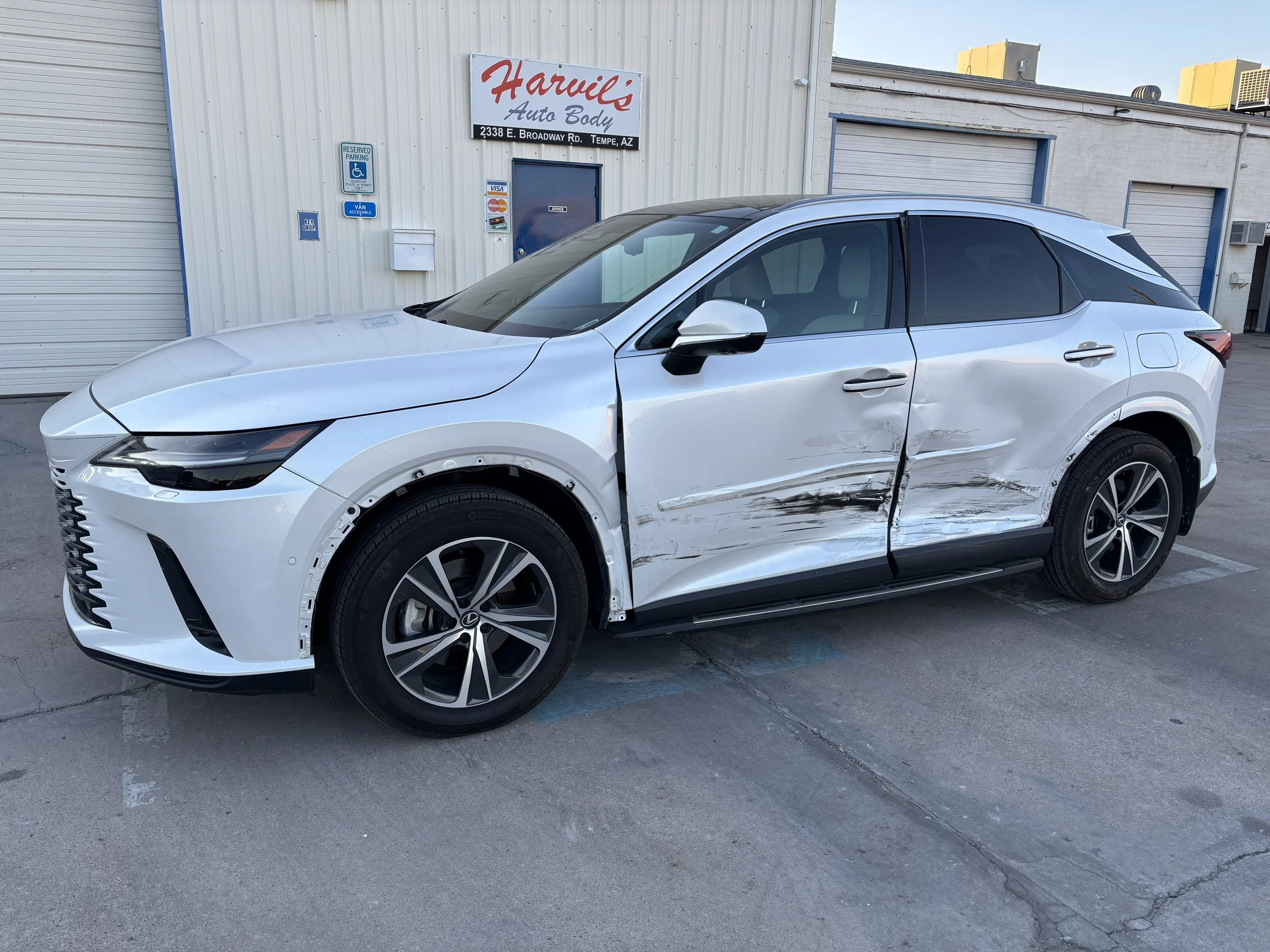 2023 Lexus RX 350h - We repaired side-swipe damage on this Lexus RX, replacing both driver-side doors and delivering a seamless, factory-quality finish.