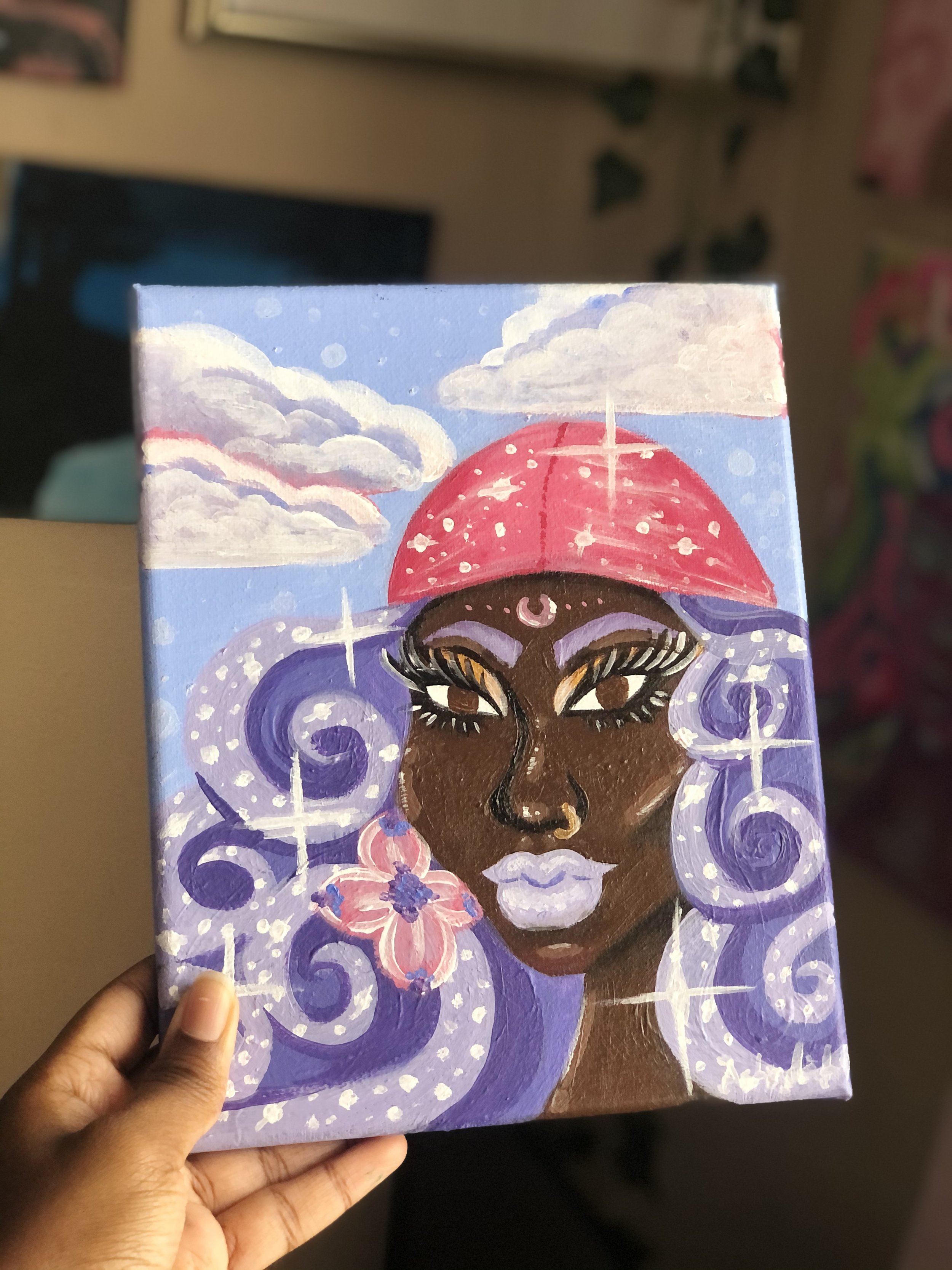 Painting of a woman with dark skin, purple curly hair, a pink umbrella hat, and a flower in her hair, set against a sky with clouds.