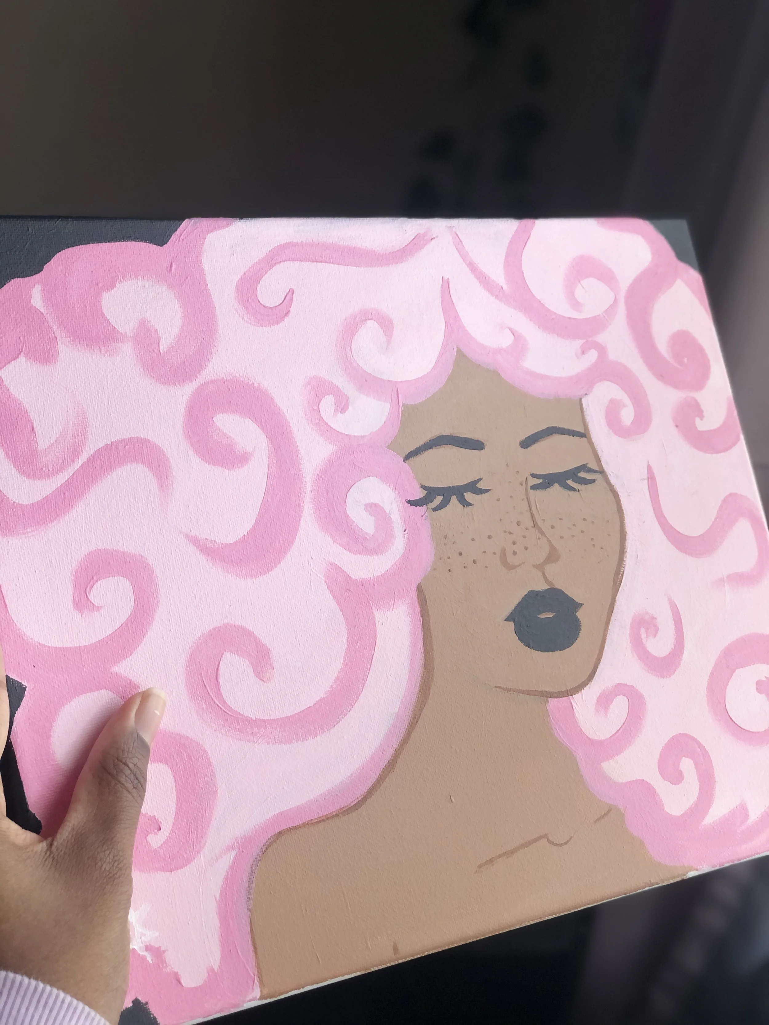 Painting of a woman with pink, curly hair, closed eyes, and dark lipstick.