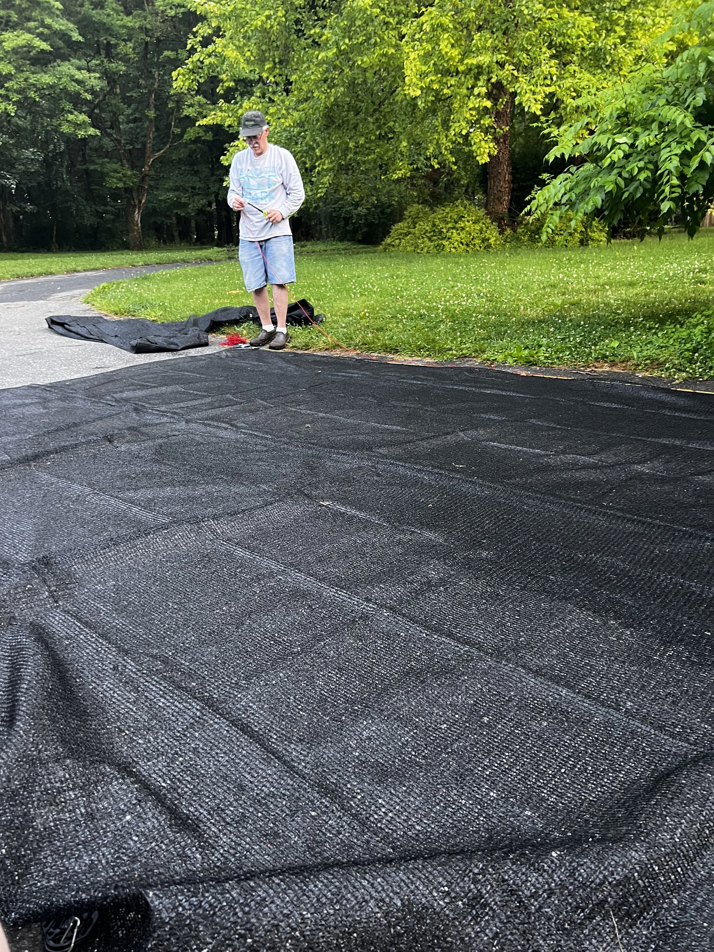 Jeff plans out the shade cloth coverings for the Pen.