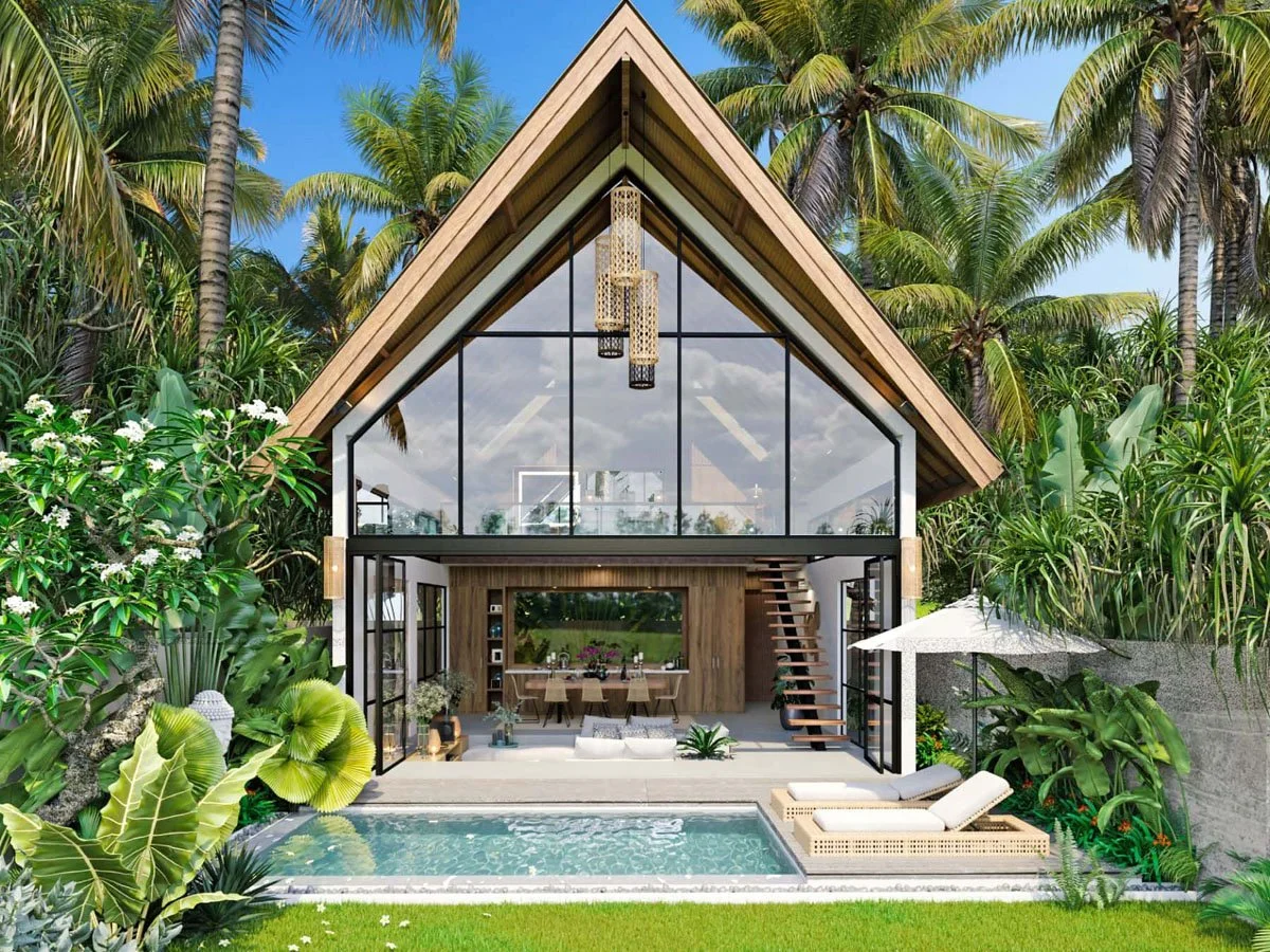 Modern house with large glass windows, surrounded by lush tropical greenery and palm trees, including a swimming pool with lounge chairs and an outdoor umbrella.