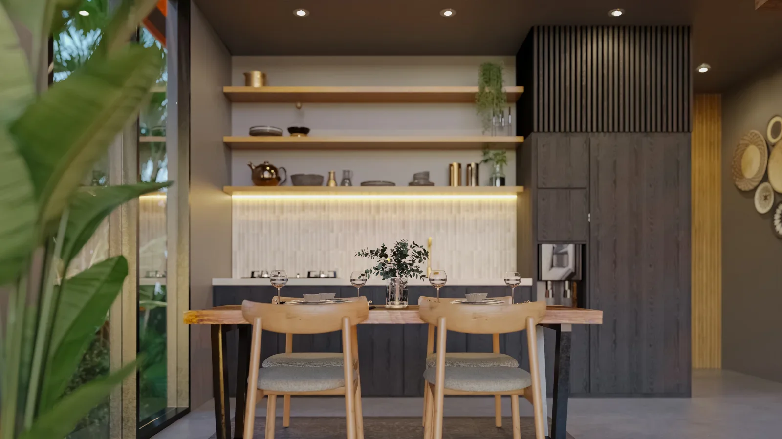 Modern kitchen with wooden dining table set for four, with wine glasses and dishes, against a backdrop of open shelves with decorative items, dark cabinets, and warm ambient lighting.