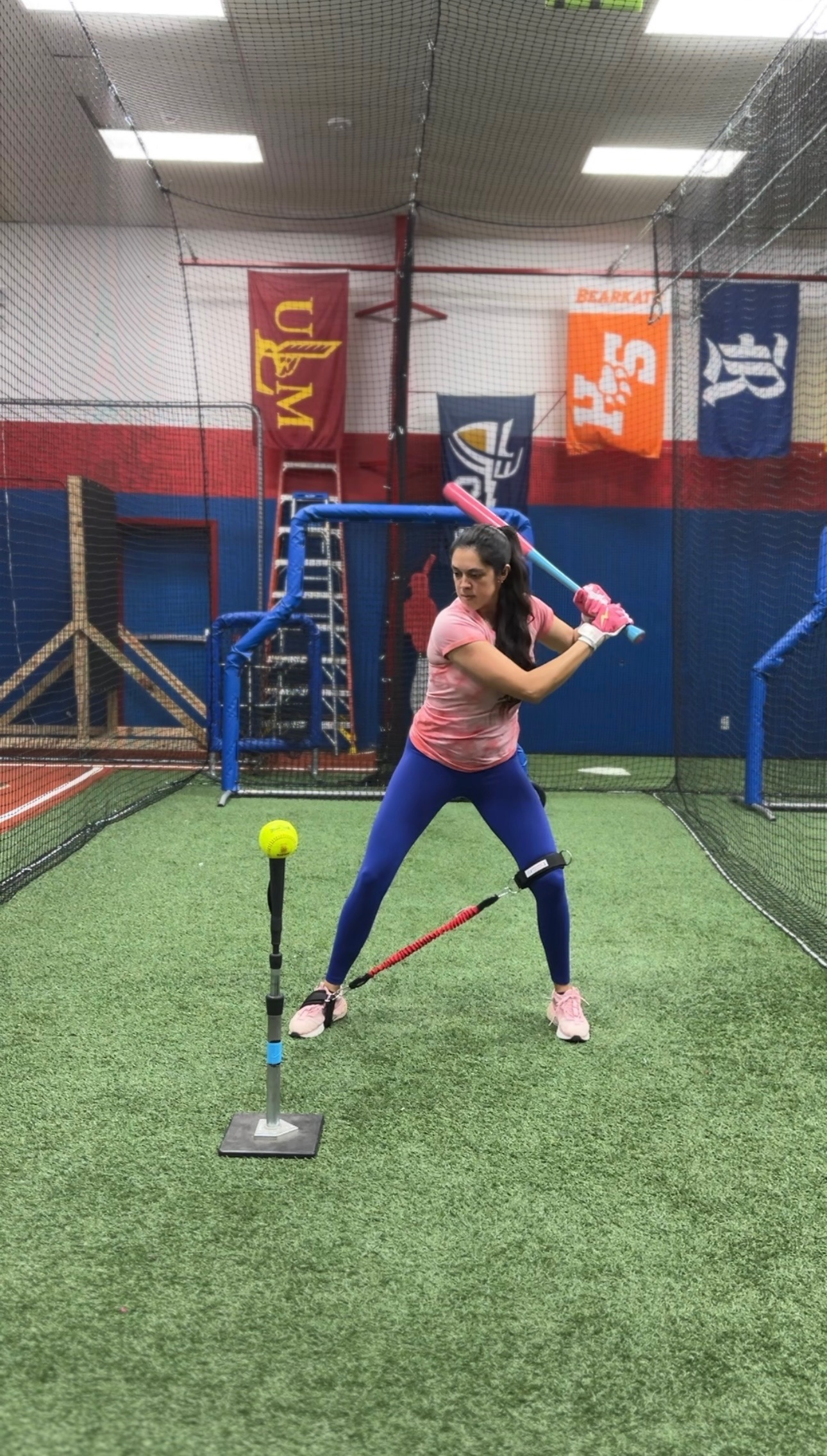 Jessica Bowden, the Softball Doctor, performing a hitting drill.