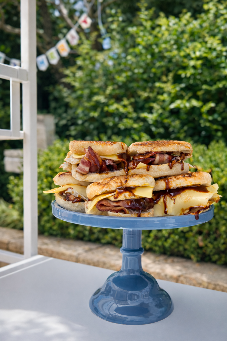 Breakfast sliders with bacon, melted cheese and barbecue sauce served at a 10 Pounds (Pyrmont) catering event.