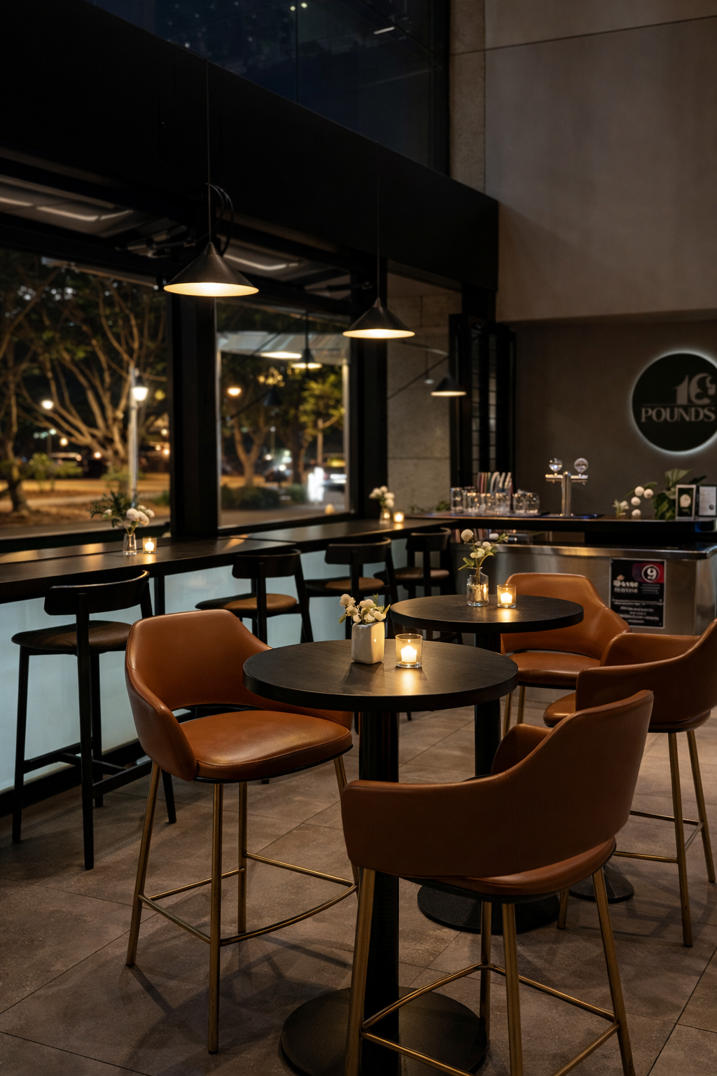 The Bar Book event space at 10 Pounds in Pyrmont with ambient lighting and cocktail tables.