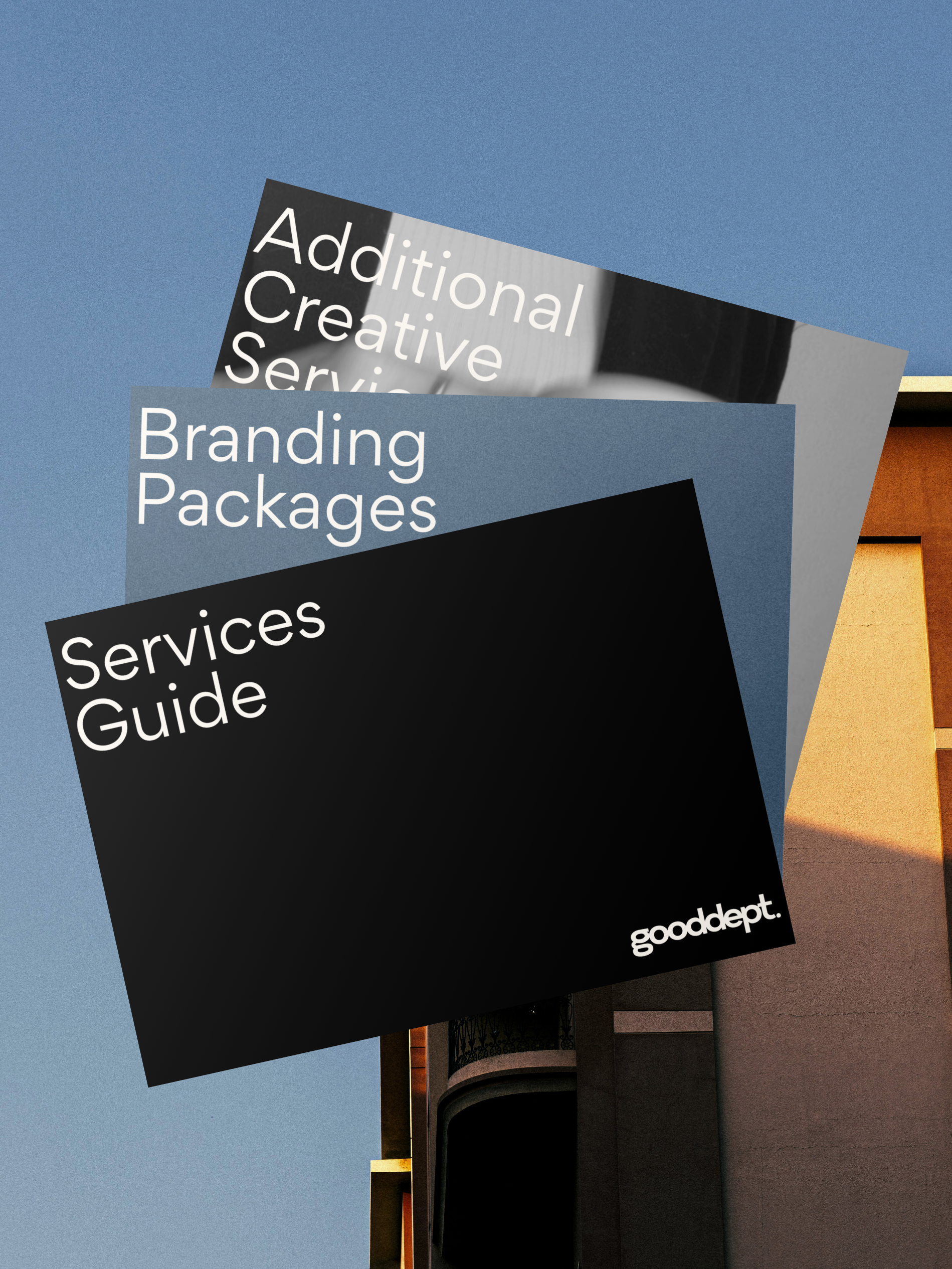 Three overlapping branding service guide booklets with black, gray, and blue covers, displaying text about branding, services, and creative packages, with a small 'gooddept.' logo in the bottom corner