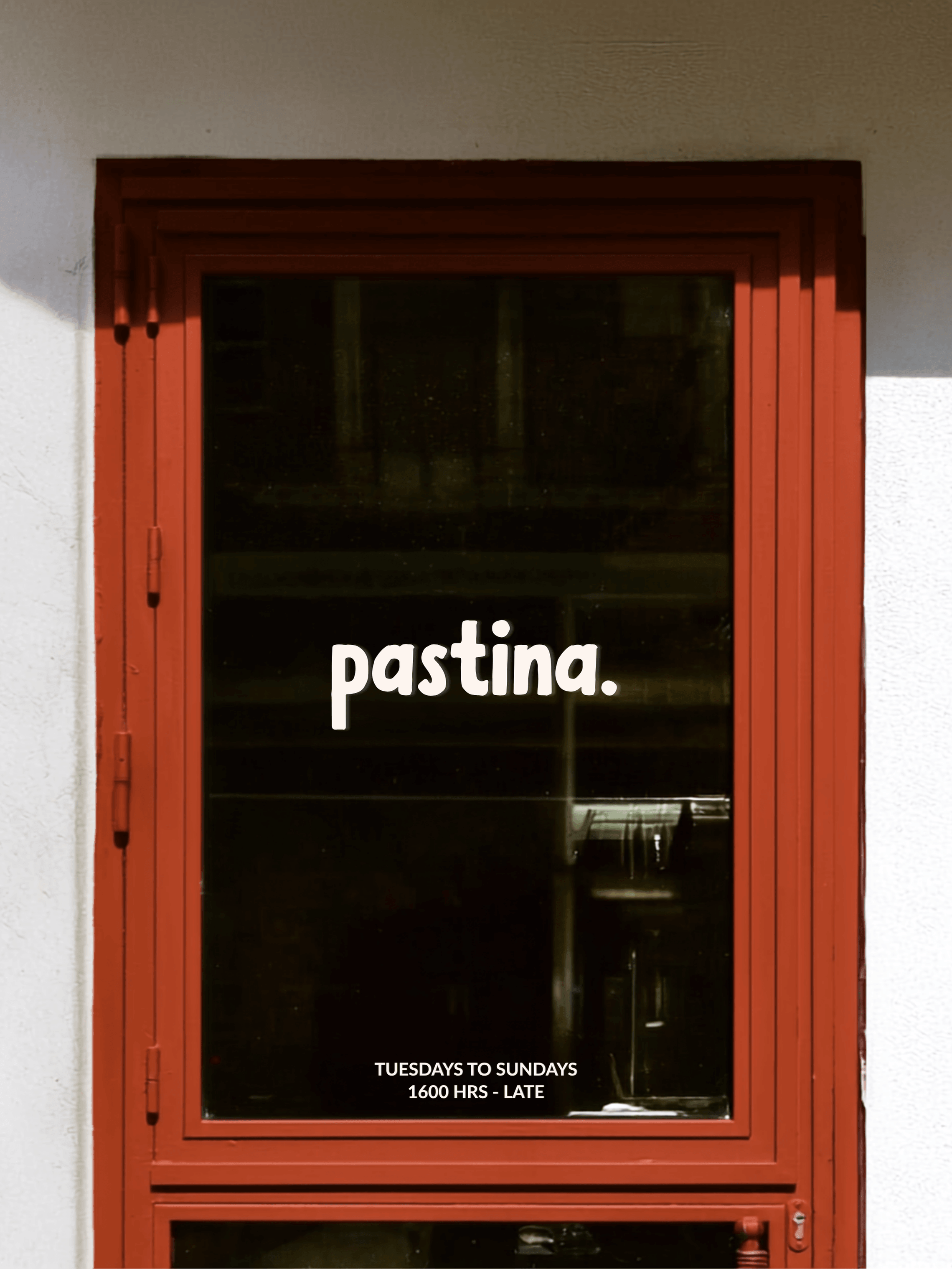 Window decal and print sticker design showcasing a restaurant logo on a glass front door. Environmental graphics and hospitality signage.