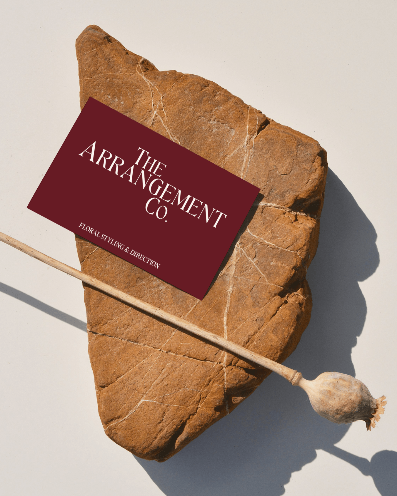 Premium business card front featuring a sophisticated editorial logo for a contemporary florist. Minimalist print collateral for an expressive visual identity.
