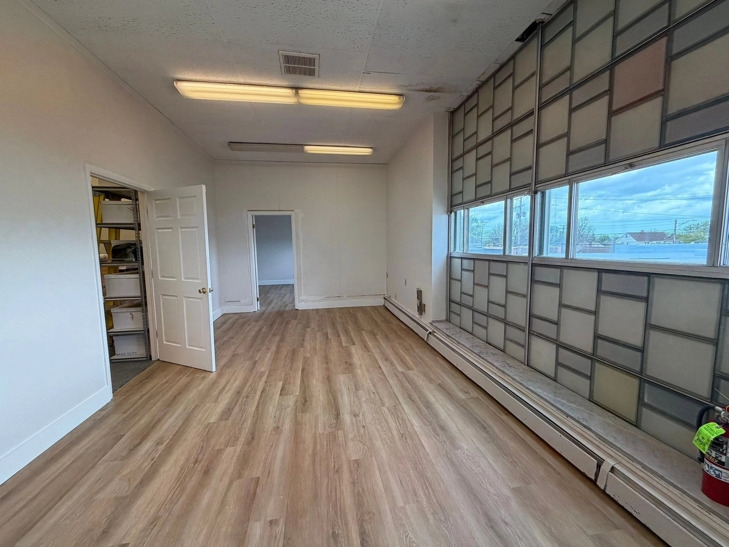Renovated office space with original glass-block windows at 5579 Pearl Road
