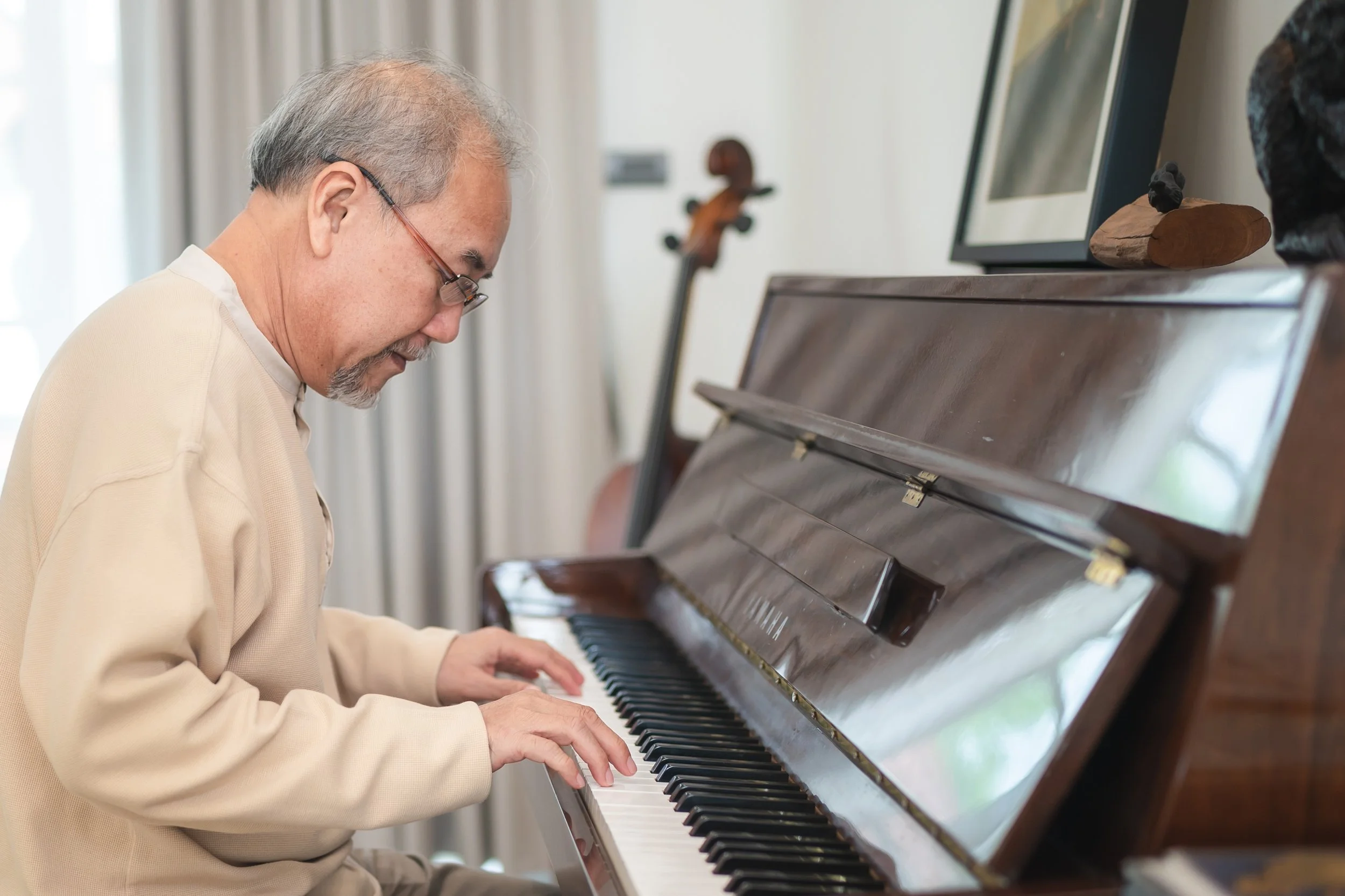 Older man playing piano.jpeg