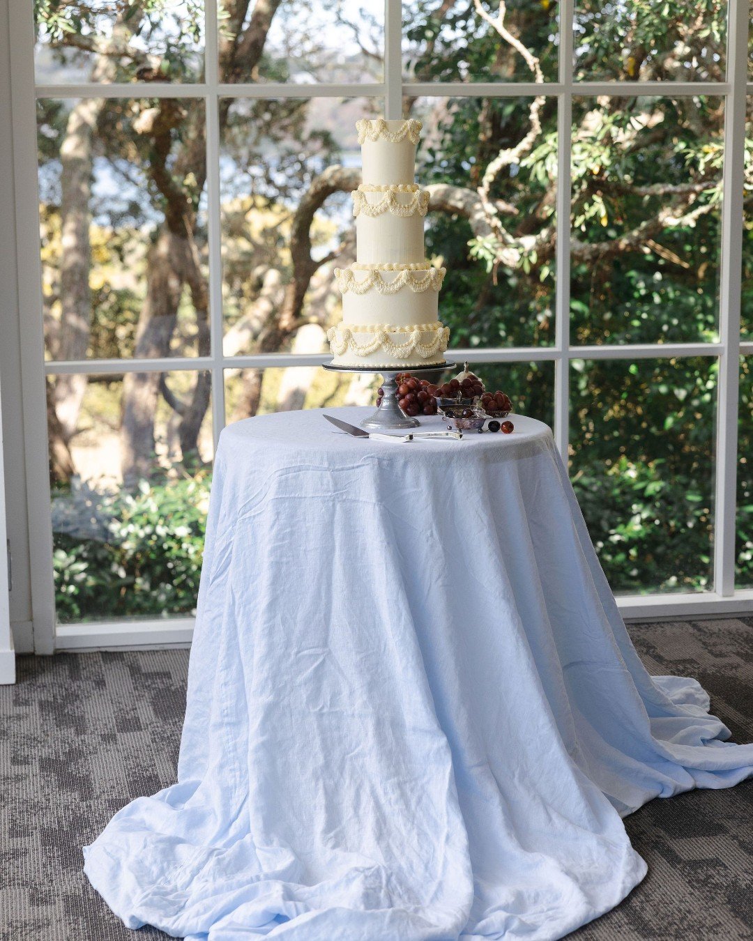 At Ōrākei Bay Venue, we&rsquo;ve seen it all, from floral-topped beauties to sleek, modern creations, and every cake adds its own touch of magic to the day. Whether it&rsquo;s set against the water and trees outside or framed by our beautiful open wi