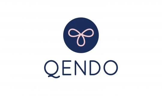 Logo with a navy blue circle containing a pink bow and the word QENDO underneath.