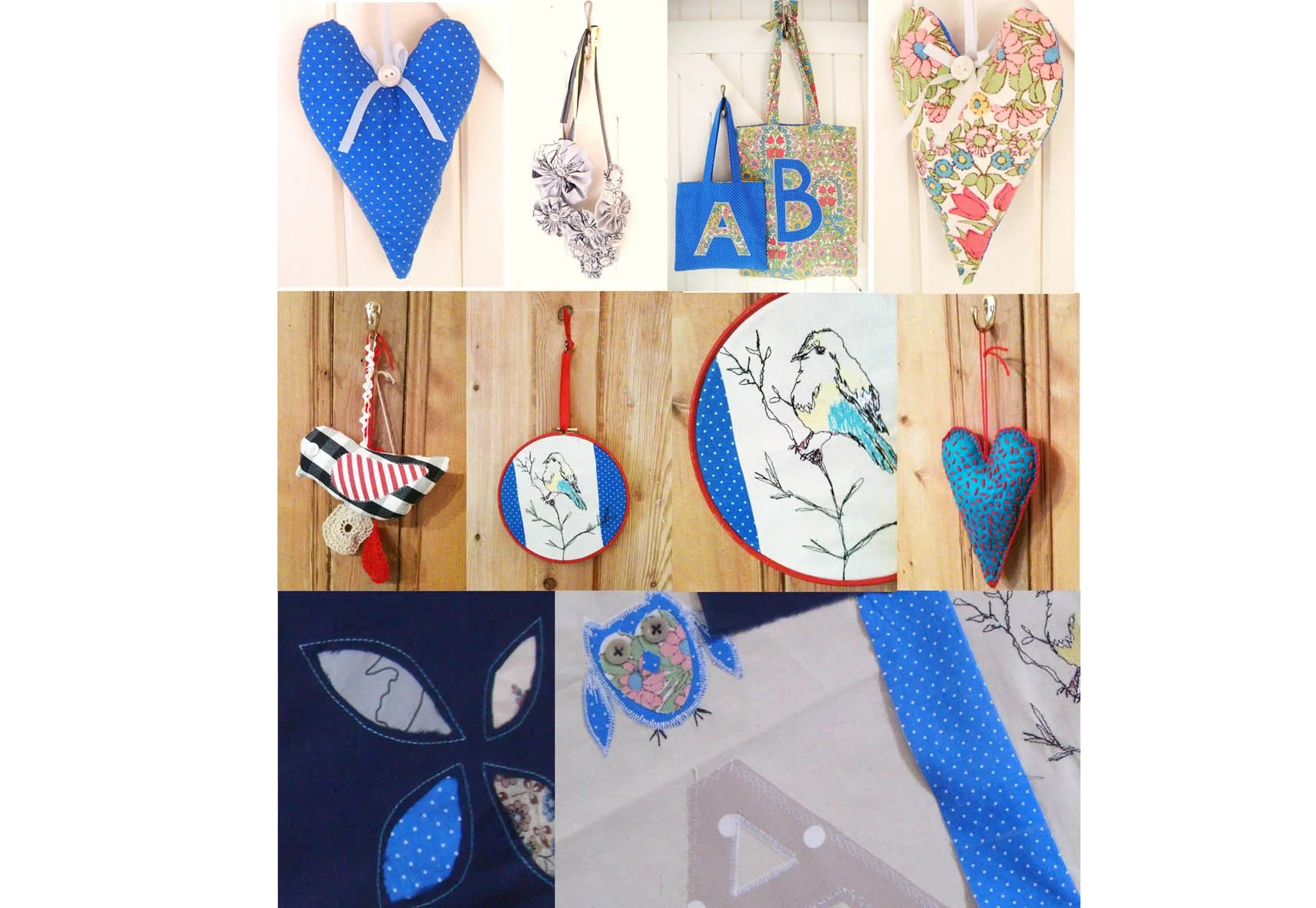 Display of handmade decorative items including fabric hearts, bags with floral and alphabet designs, embroidered bird and branch pictures, and fabric applique crafts, all arranged on a wooden background and white wall.