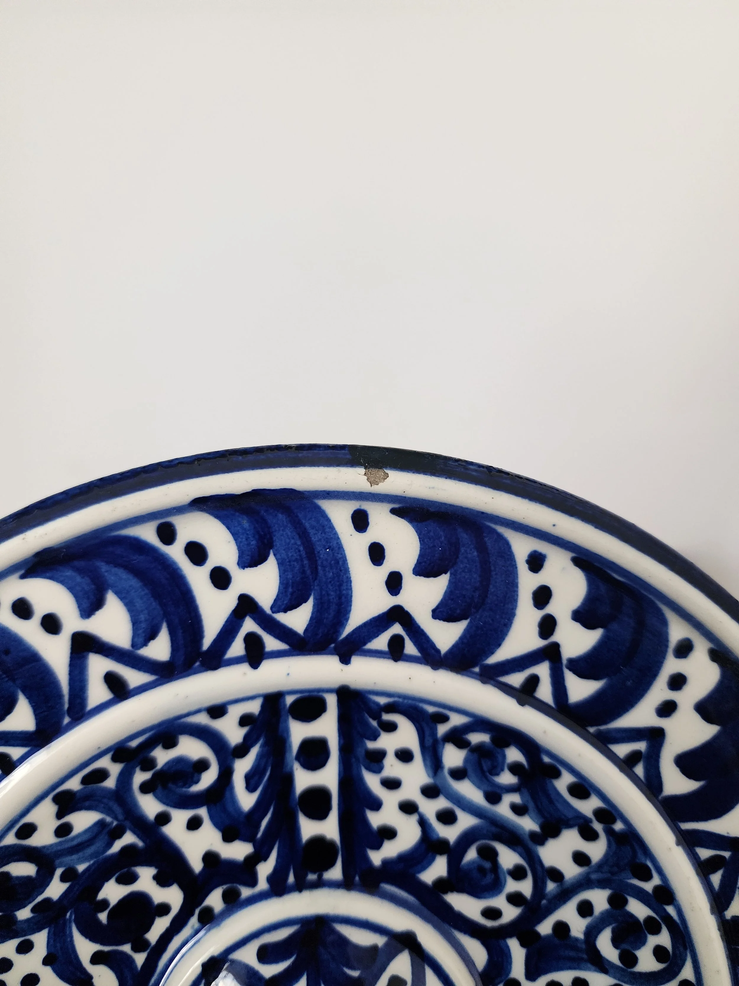 Close-up of intricate floral and geometric hand painting.